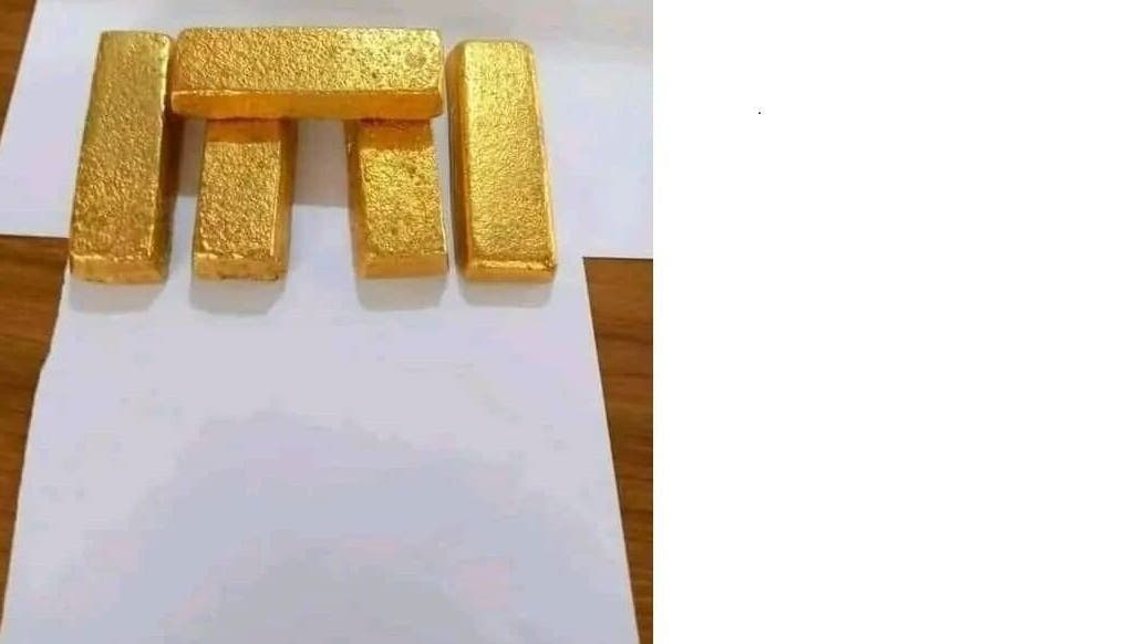 Gold bars from Buy Pure Gold Nuggets Investment Gold Bars in Africa Nairobi, Nairobi County, KE displayed on white paper.