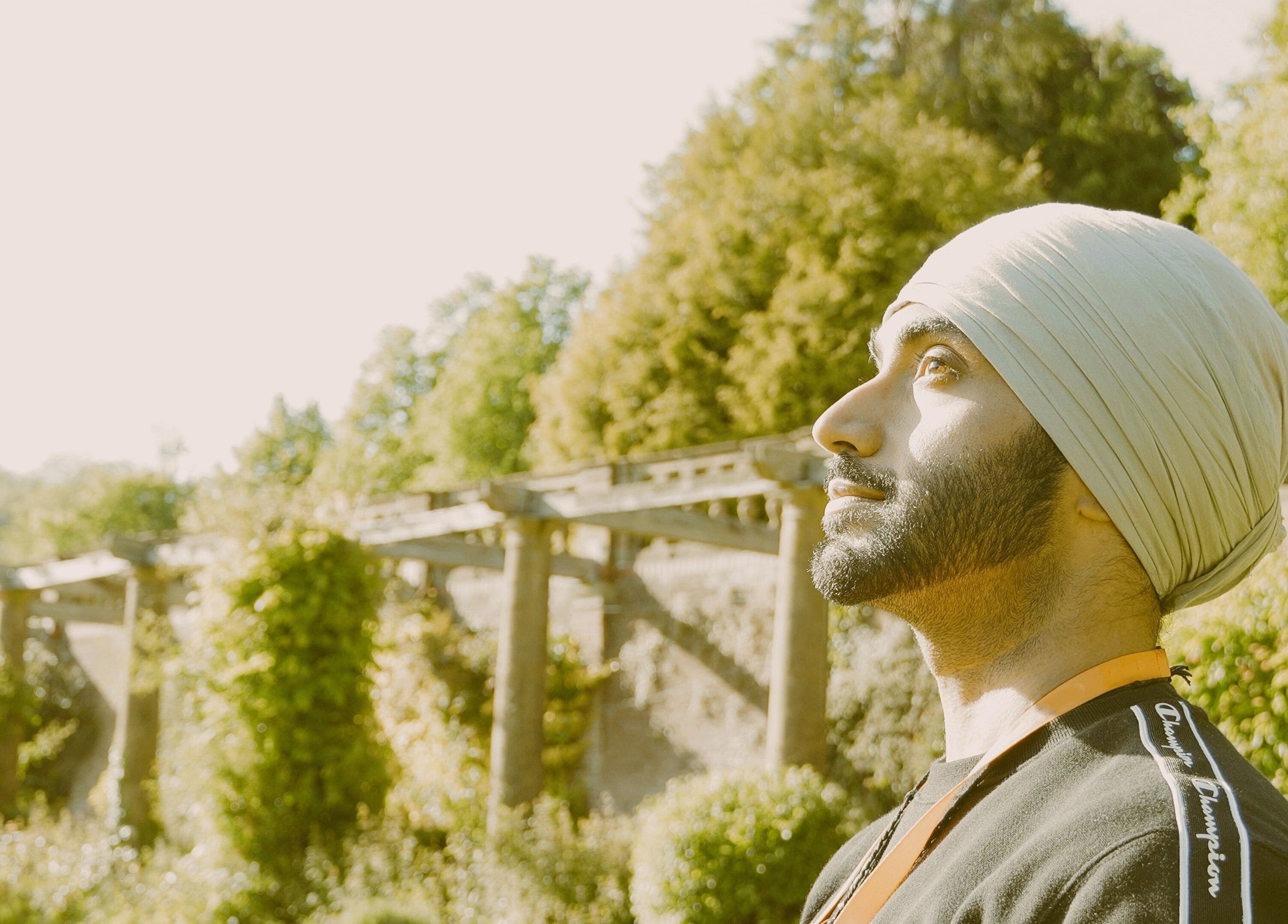 Person reflecting amid nature at Seek Within, Walsall, England, GB, showcasing tranquility and mindfulness.