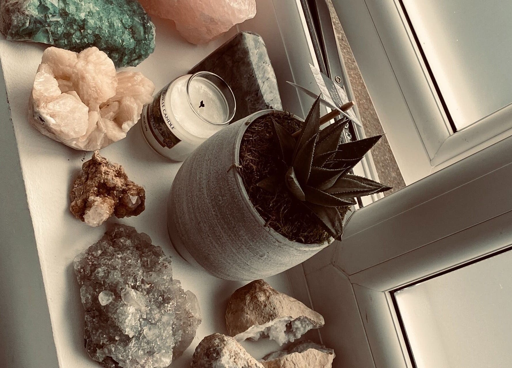 Decorative crystals and plant at Seek Within, Walsall, England, GB. Enhancing tranquility and wellness space.
