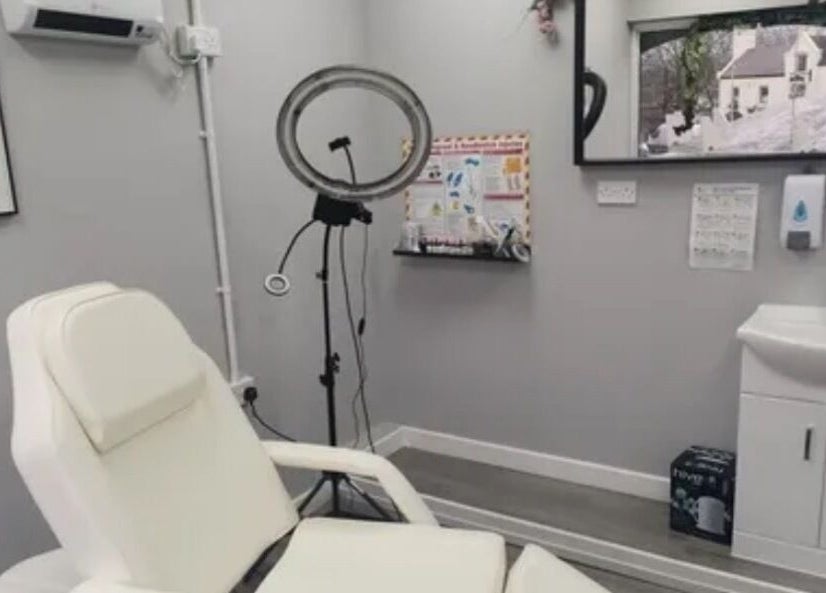 Massage room at Harmony Hands Massage Group, Kingswinford, England, GB, featuring modern decor and massage chair.