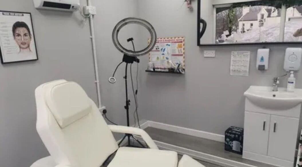 Massage room at Harmony Hands Massage Group, Kingswinford, England, GB, featuring modern decor and massage chair.