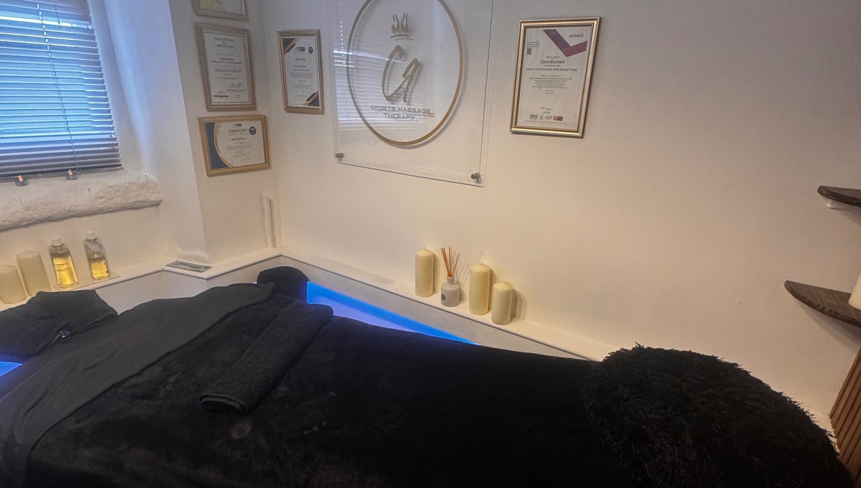 Tranquil massage room at Harmony Hands Derby in Derby, England, GB, featuring a comfortable black massage table.