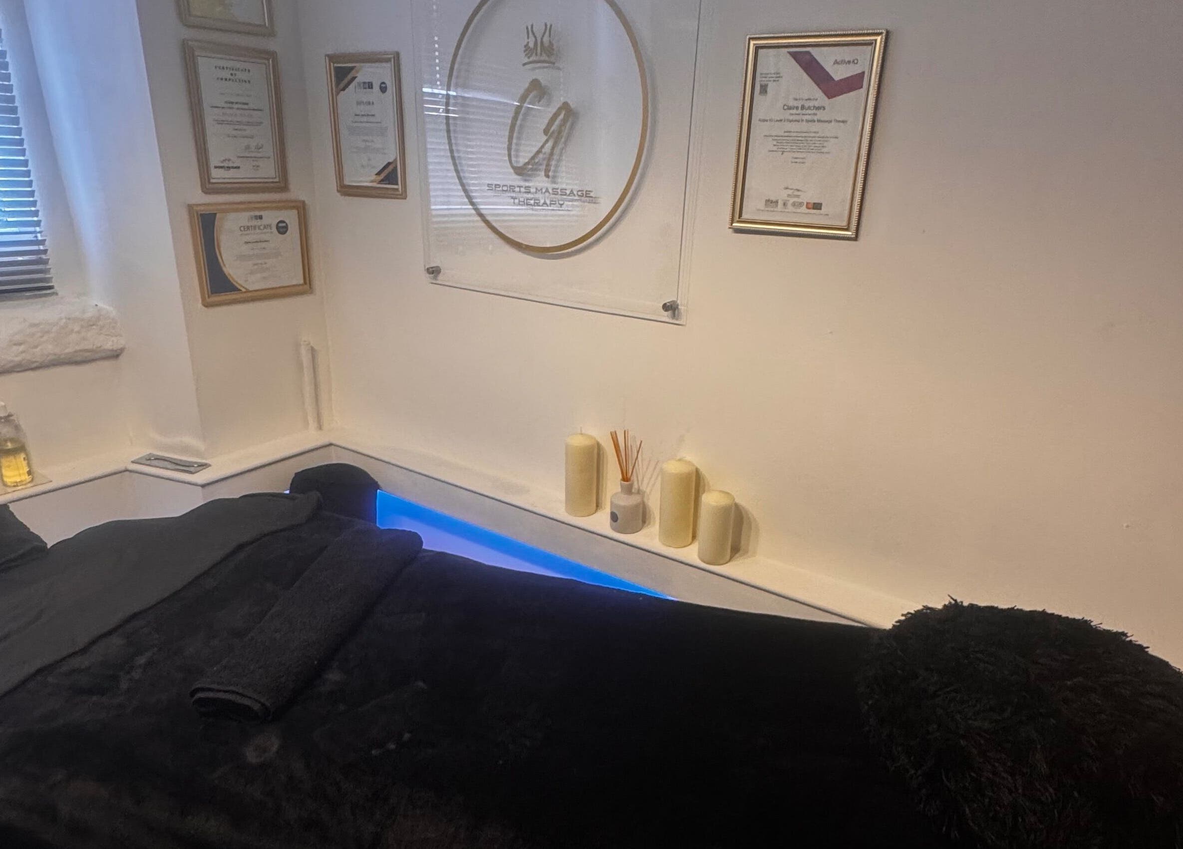 Tranquil massage room at Harmony Hands Derby in Derby, England, GB, featuring a comfortable black massage table.