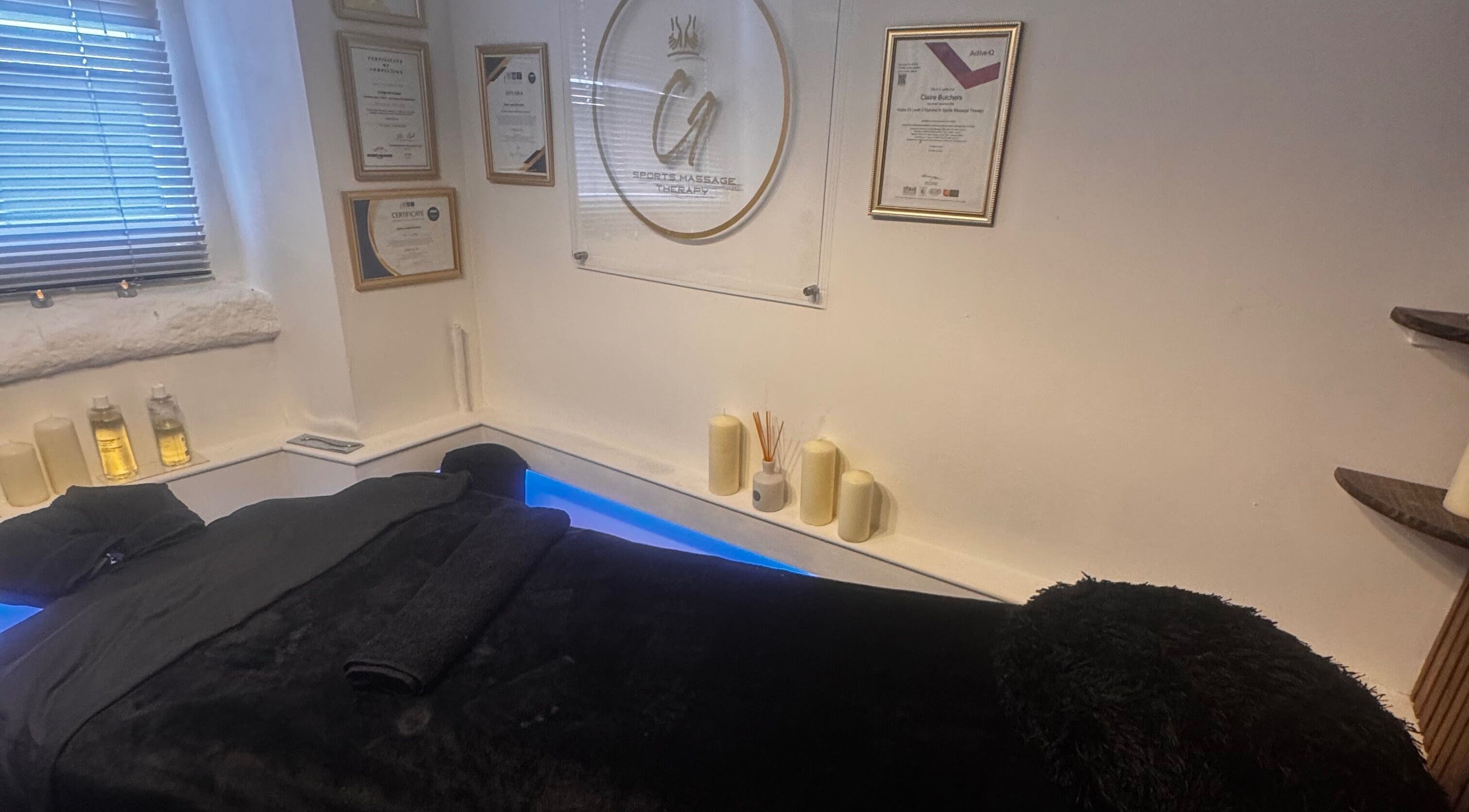 Tranquil massage room at Harmony Hands Derby in Derby, England, GB, featuring a comfortable black massage table.