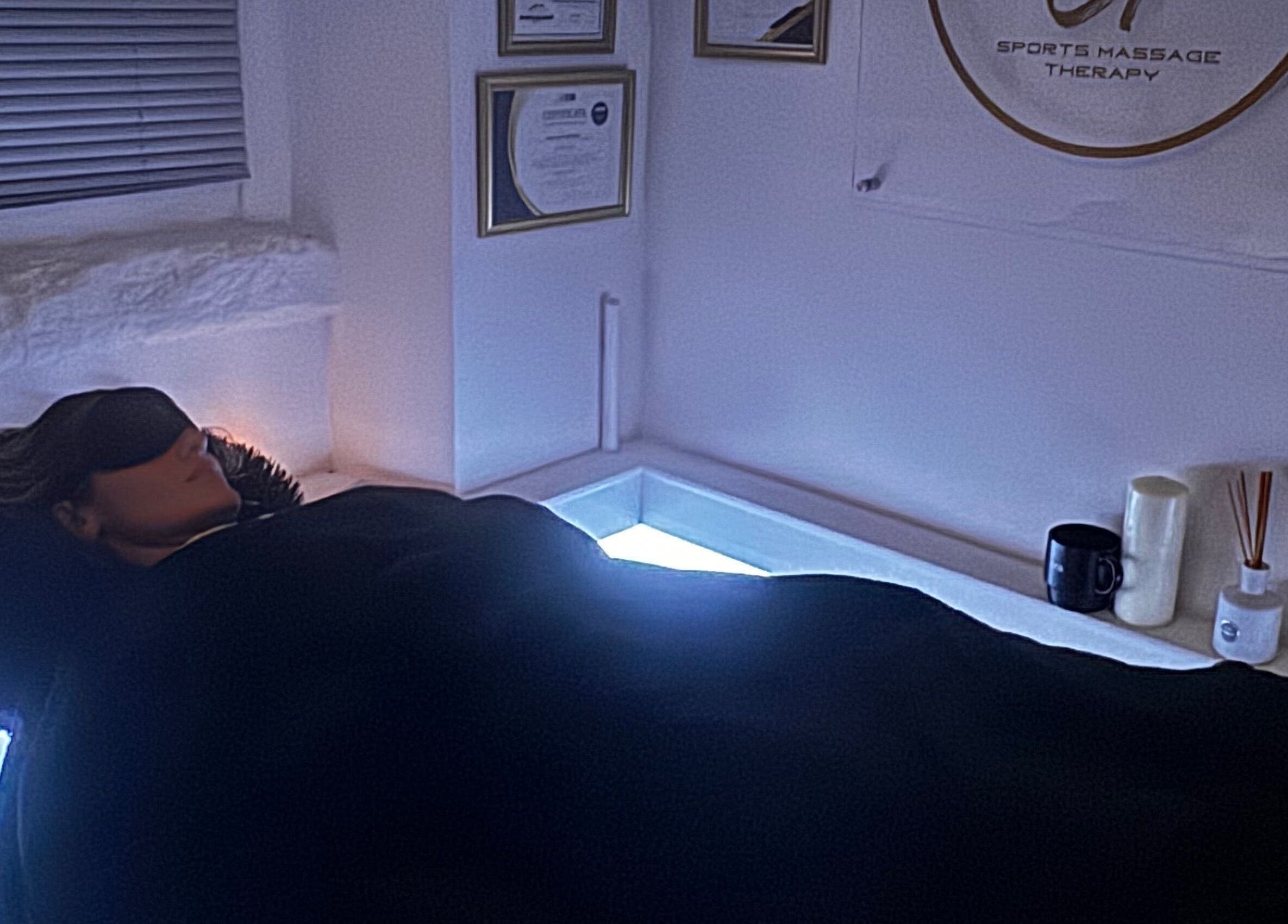 Relaxing scene at Harmony Hands Derby, Derby, England, GB. Client enjoys peaceful massage therapy session.