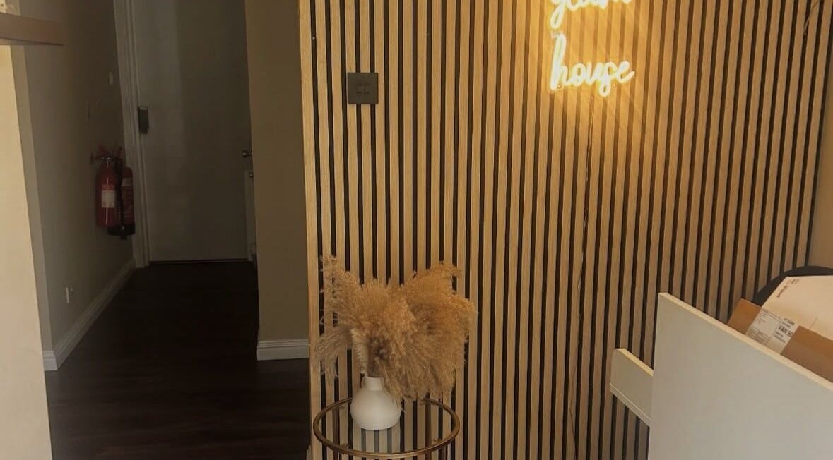 Modern entrance at Hair by Casey, Edinburgh, Scotland, GB with wood paneling and soft lighting.