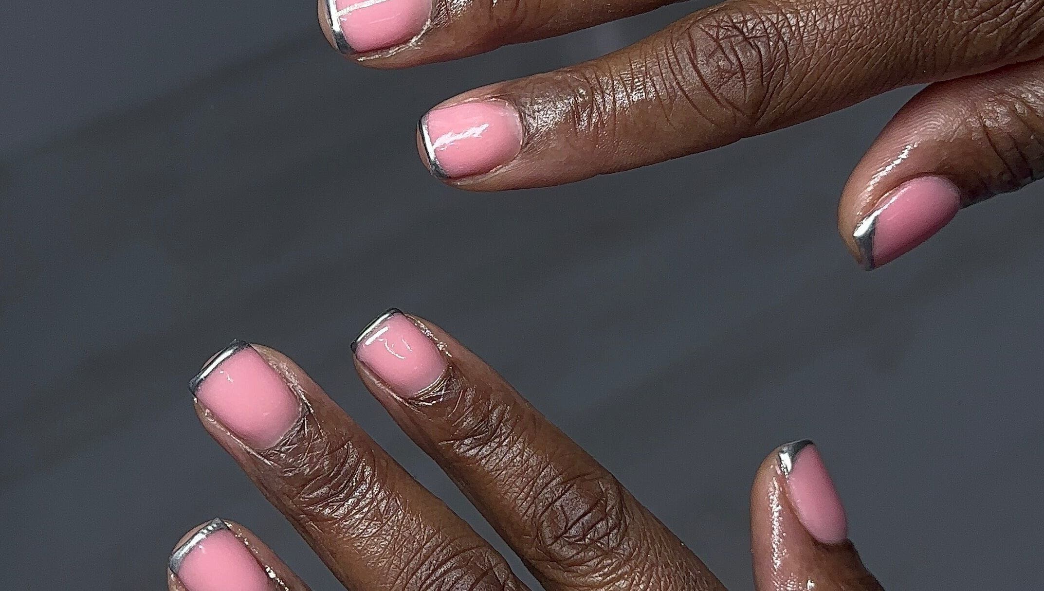 Elegant pink and silver nails at Nailedbylaurinda, Birmingham, England, GB showcasing nail artistry.