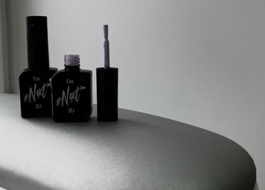 Stylish nail polish bottles at Nailedbylaurinda, Birmingham, England, GB. Elegant manicure essentials displayed.