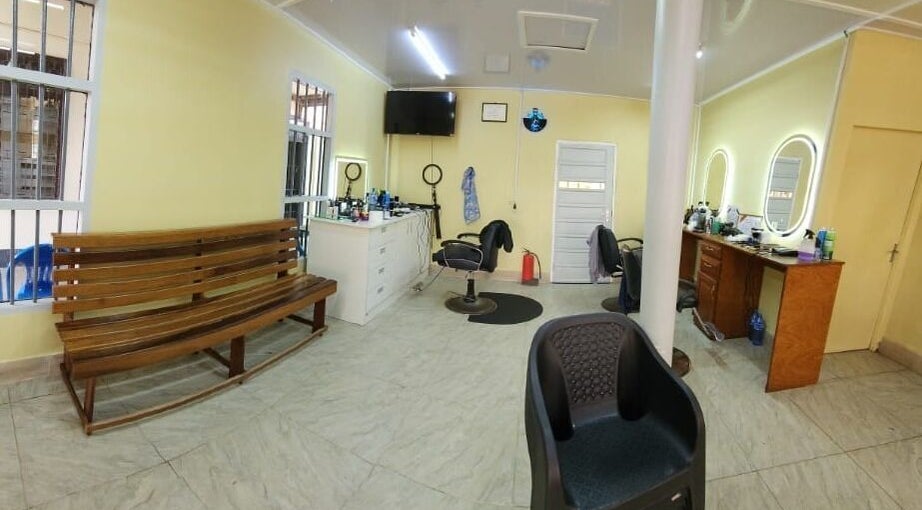 Chic interior of Raoef's Barbershop, Nieuwe Grond, Wanica, SR showcasing stylish barber chairs and mirrors.