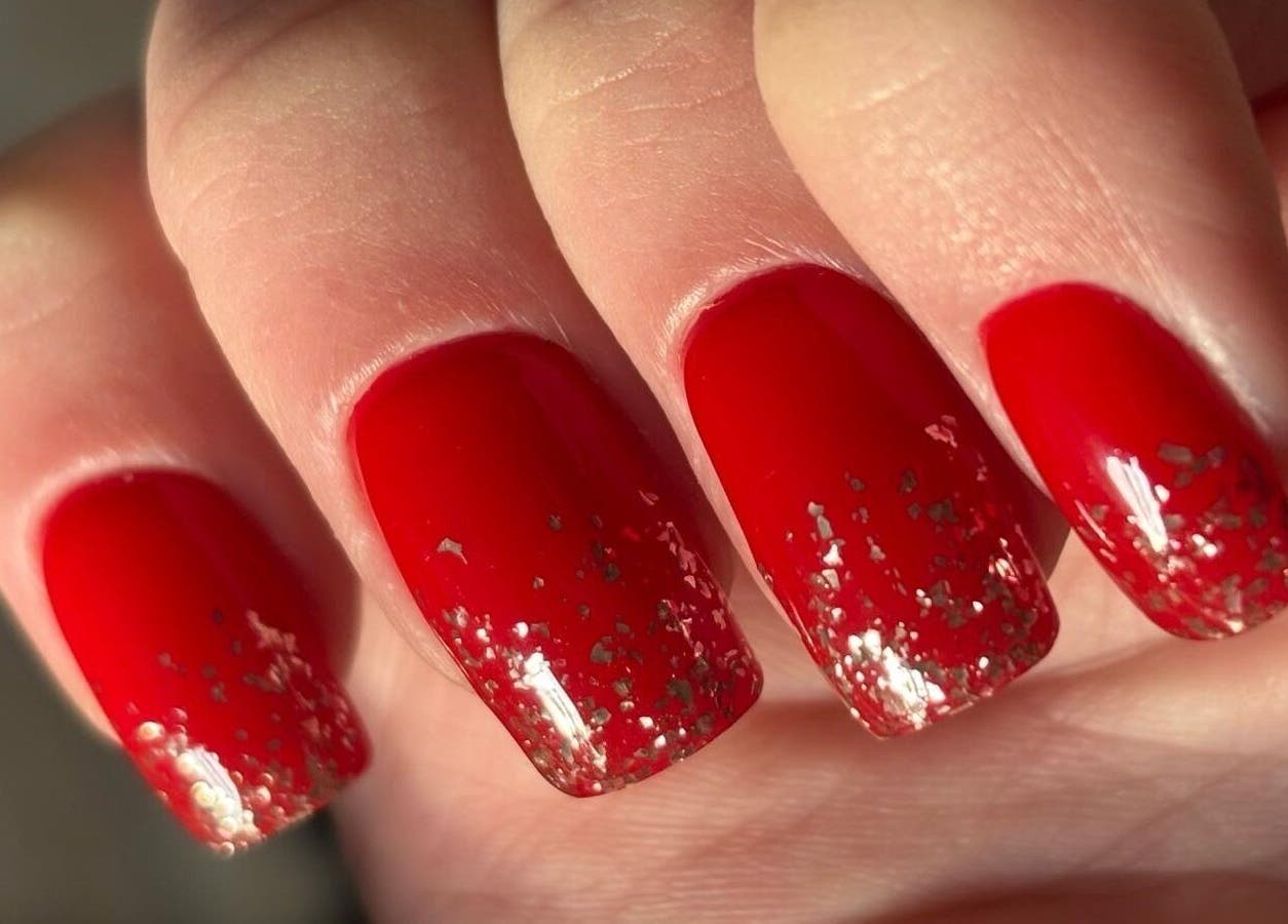 Red glitter nails from Stirling Nail Art, Stirling, Scotland, GB, showcasing artistic nail design.