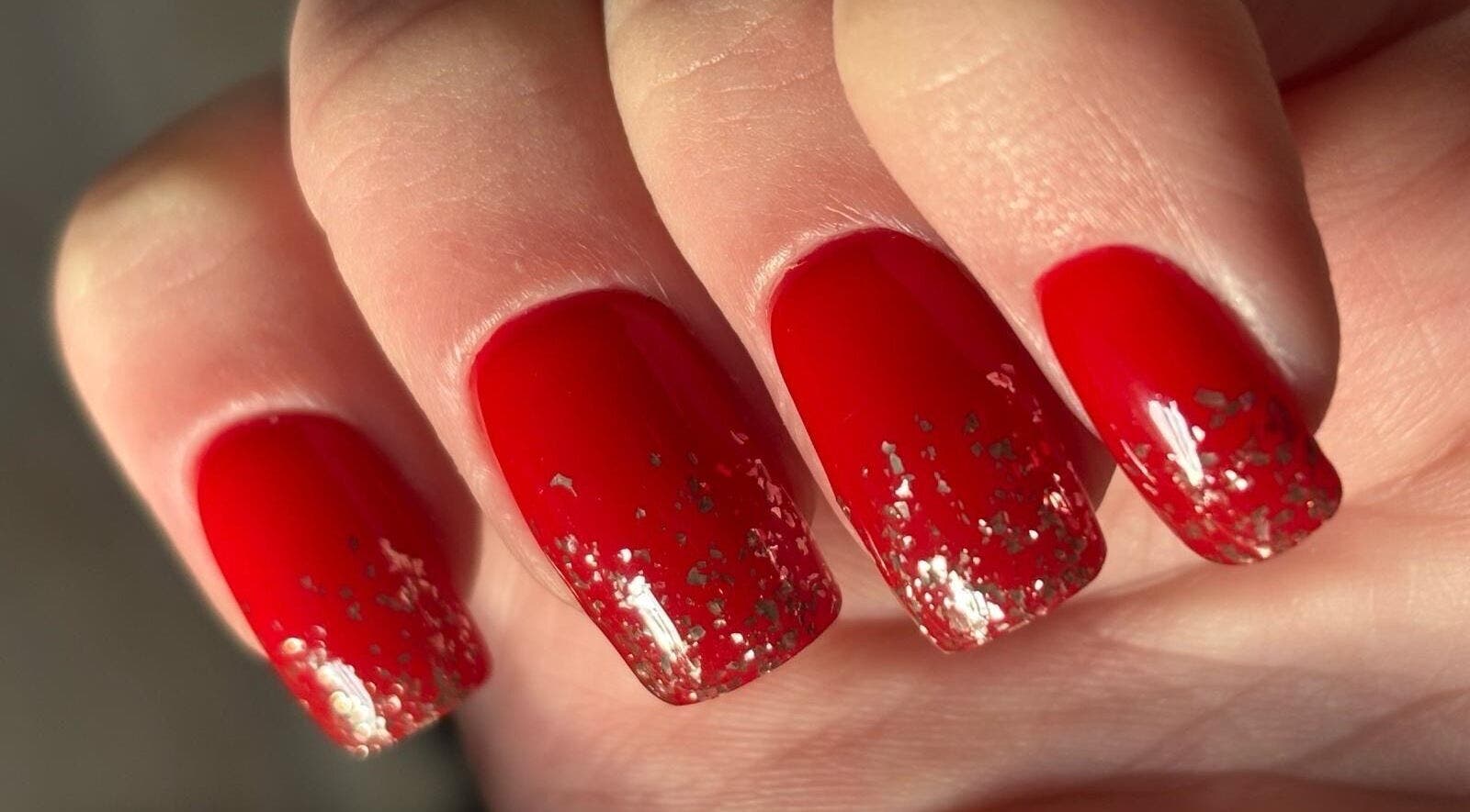 Red glitter nails from Stirling Nail Art, Stirling, Scotland, GB, showcasing artistic nail design.