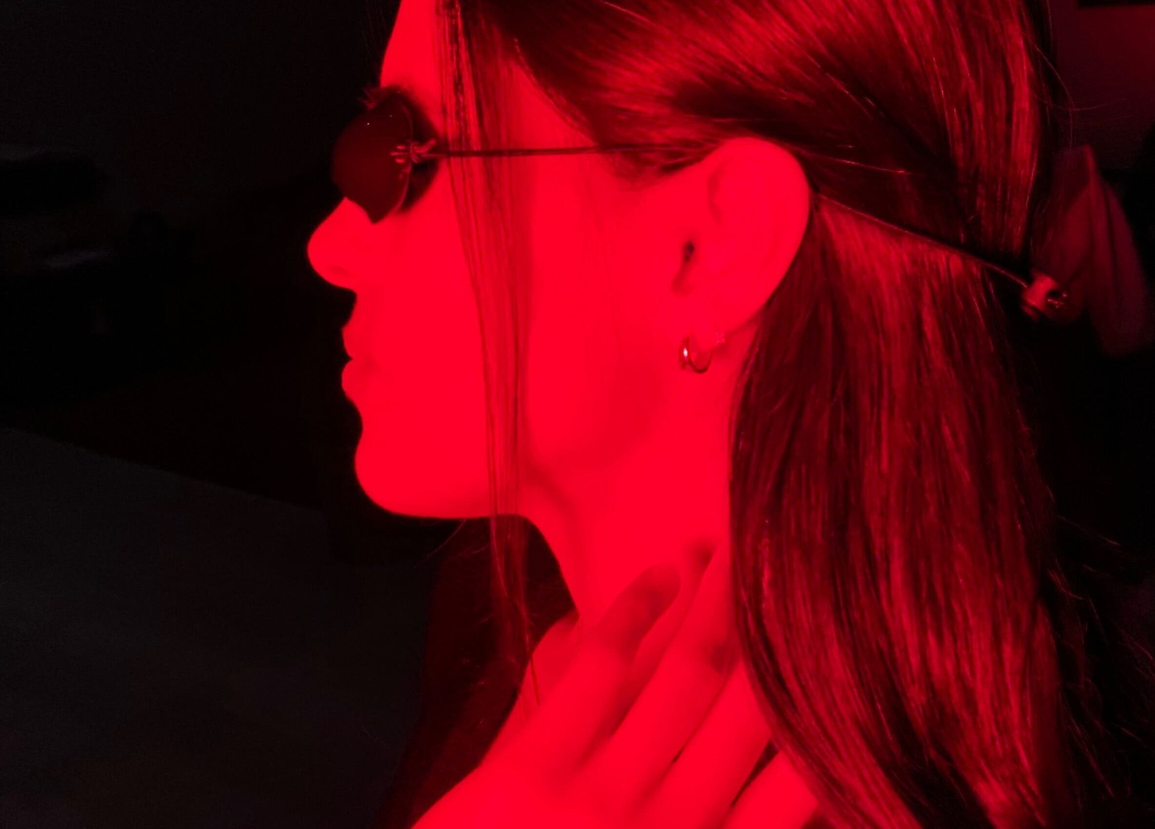 A woman enjoying red light therapy at GlowHaus, Umhlanga, Kwazulu-natal, ZA. Enhancing skin wellness.