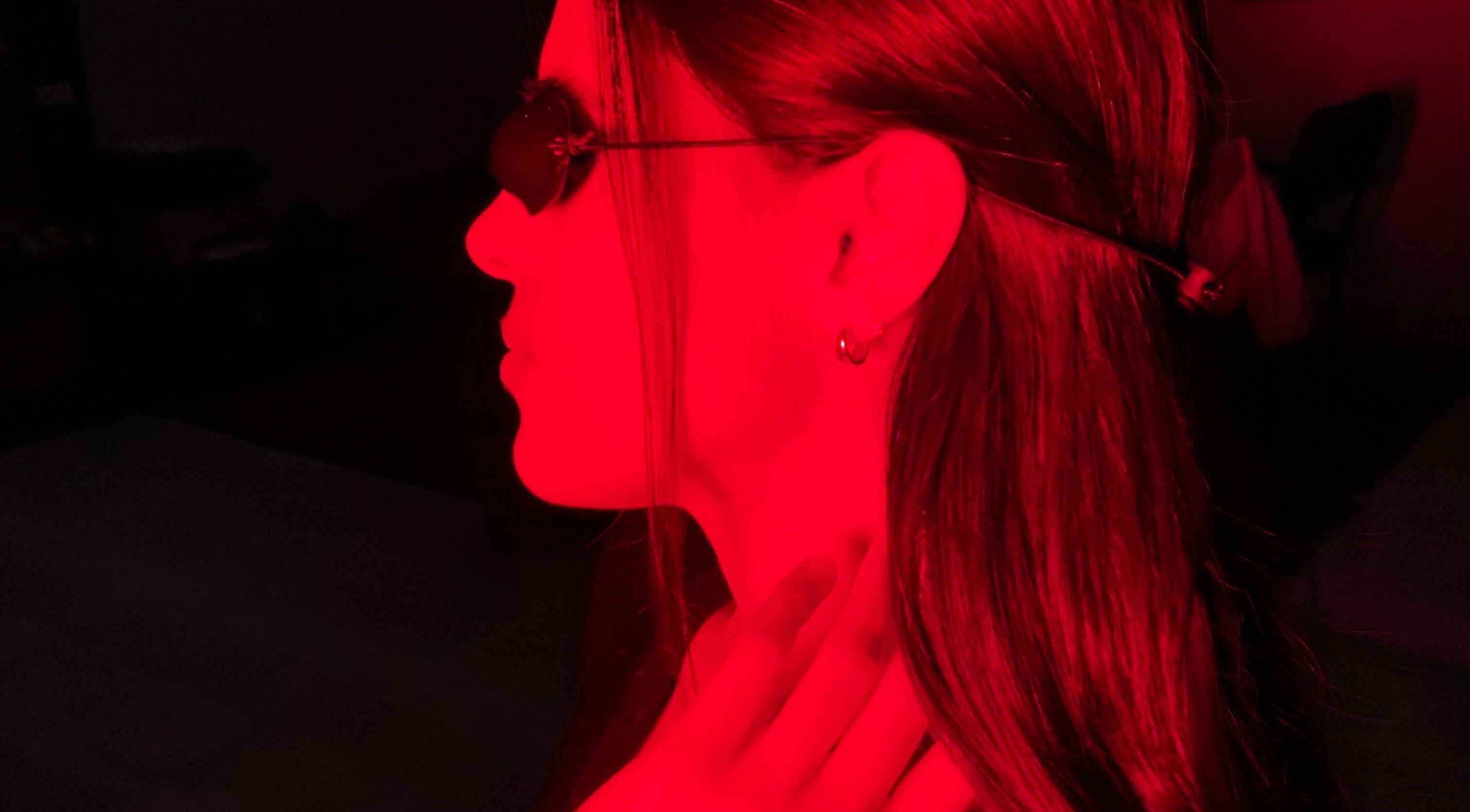 A woman enjoying red light therapy at GlowHaus, Umhlanga, Kwazulu-natal, ZA. Enhancing skin wellness.