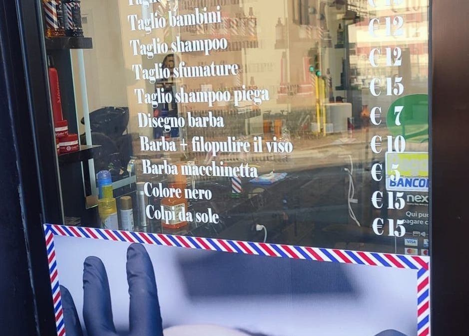 Paris by Italy barber services price list displayed in Paderno Dugnano, Lombardia, IT.