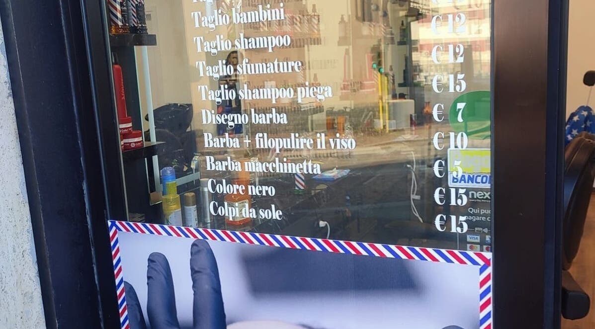 Paris by Italy barber services price list displayed in Paderno Dugnano, Lombardia, IT.