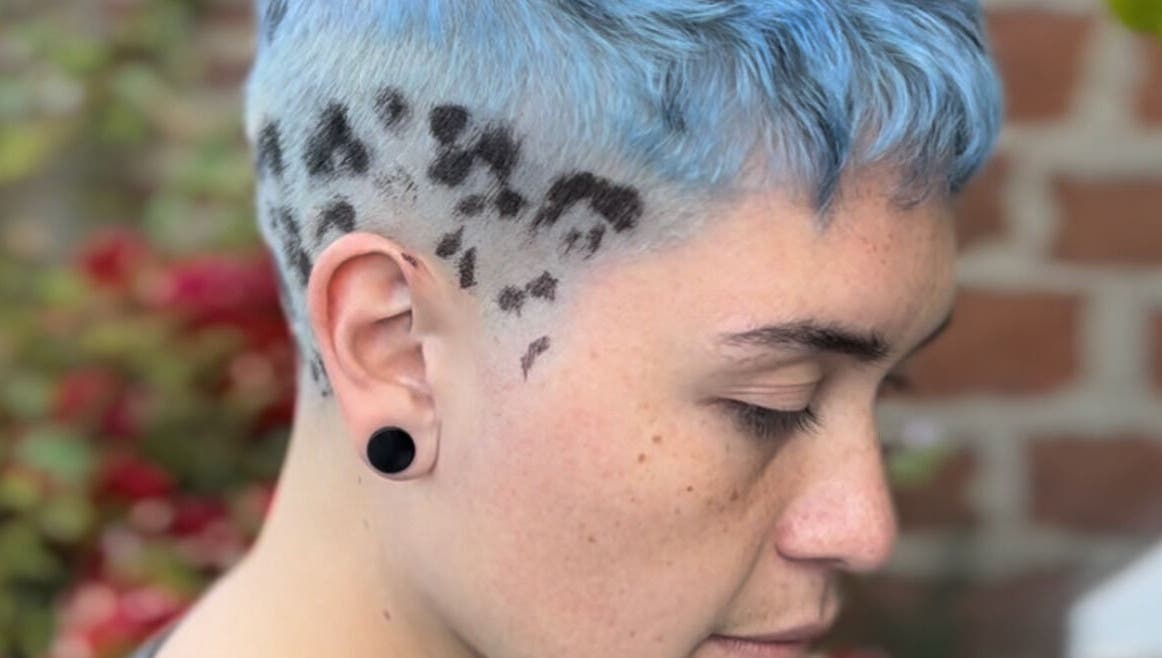 Unique blue fade hairstyle with leopard print at Indiscretx, Valparaíso, Valparaíso, CL.