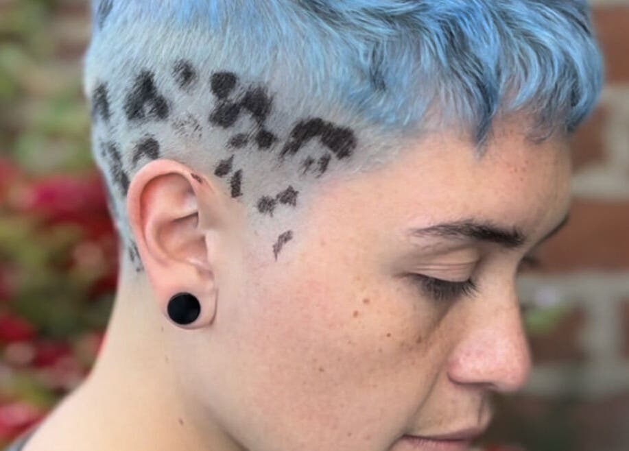 Unique blue fade hairstyle with leopard print at Indiscretx, Valparaíso, Valparaíso, CL.