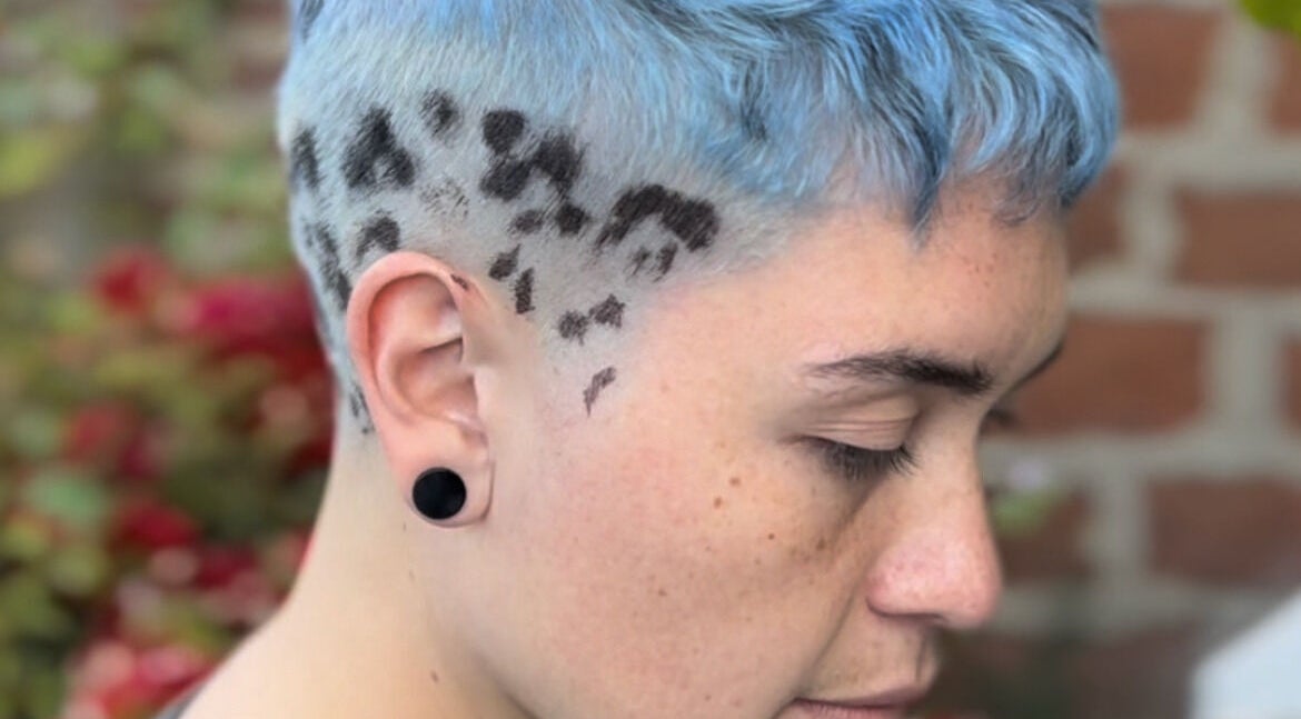 Stylish blue hairstyle with artistic fade at Indiscretx, Valparaíso, Valparaíso, CL.