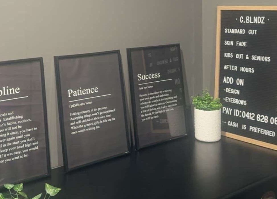Inspiring quotes at C.blndz Private Studio, Melbourne, Victoria, AU, detailed in elegant frames on a dark countertop.