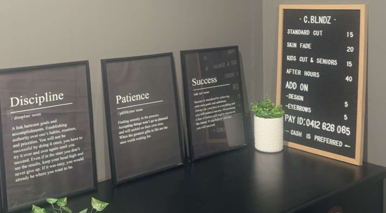 Inspiring quotes at C.blndz Private Studio, Melbourne, Victoria, AU, detailed in elegant frames on a dark countertop.