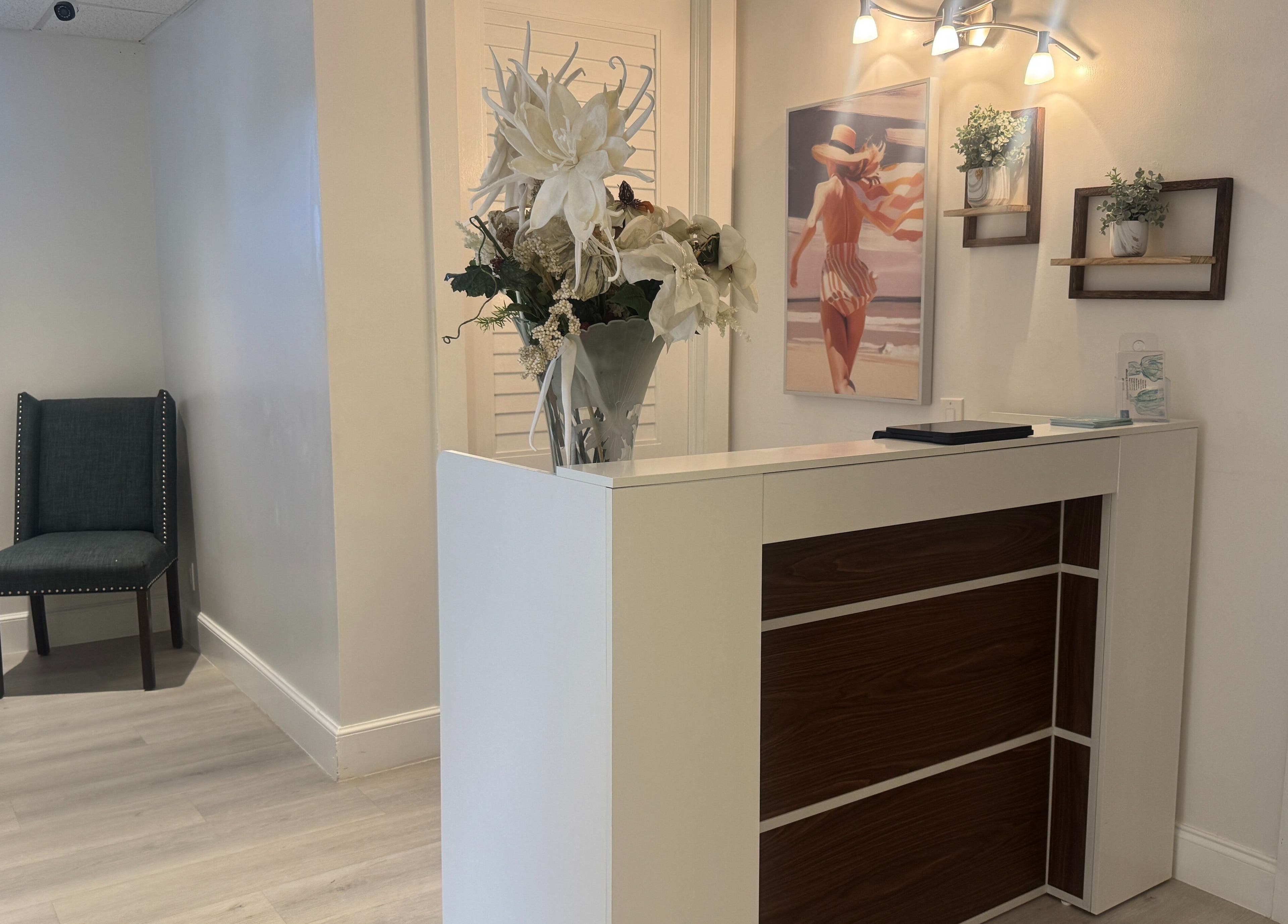 Reception area at Cryo Sculpting Lab - Boca, Boca Raton, Florida, US with flowers and seating.