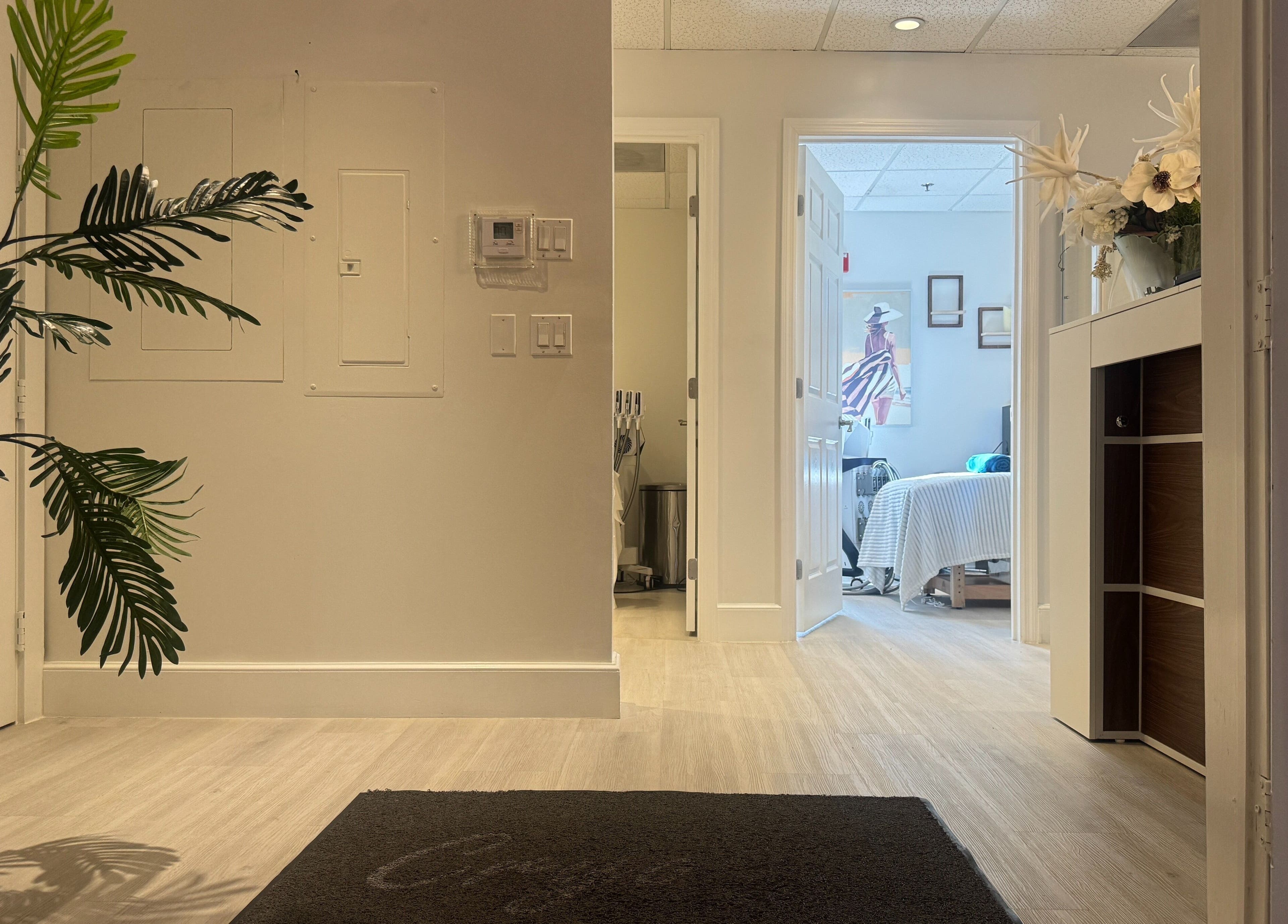 View of the inviting hallway leading to a treatment room at Cryo Sculpting Lab - Boca, Boca Raton, Florida, US.
