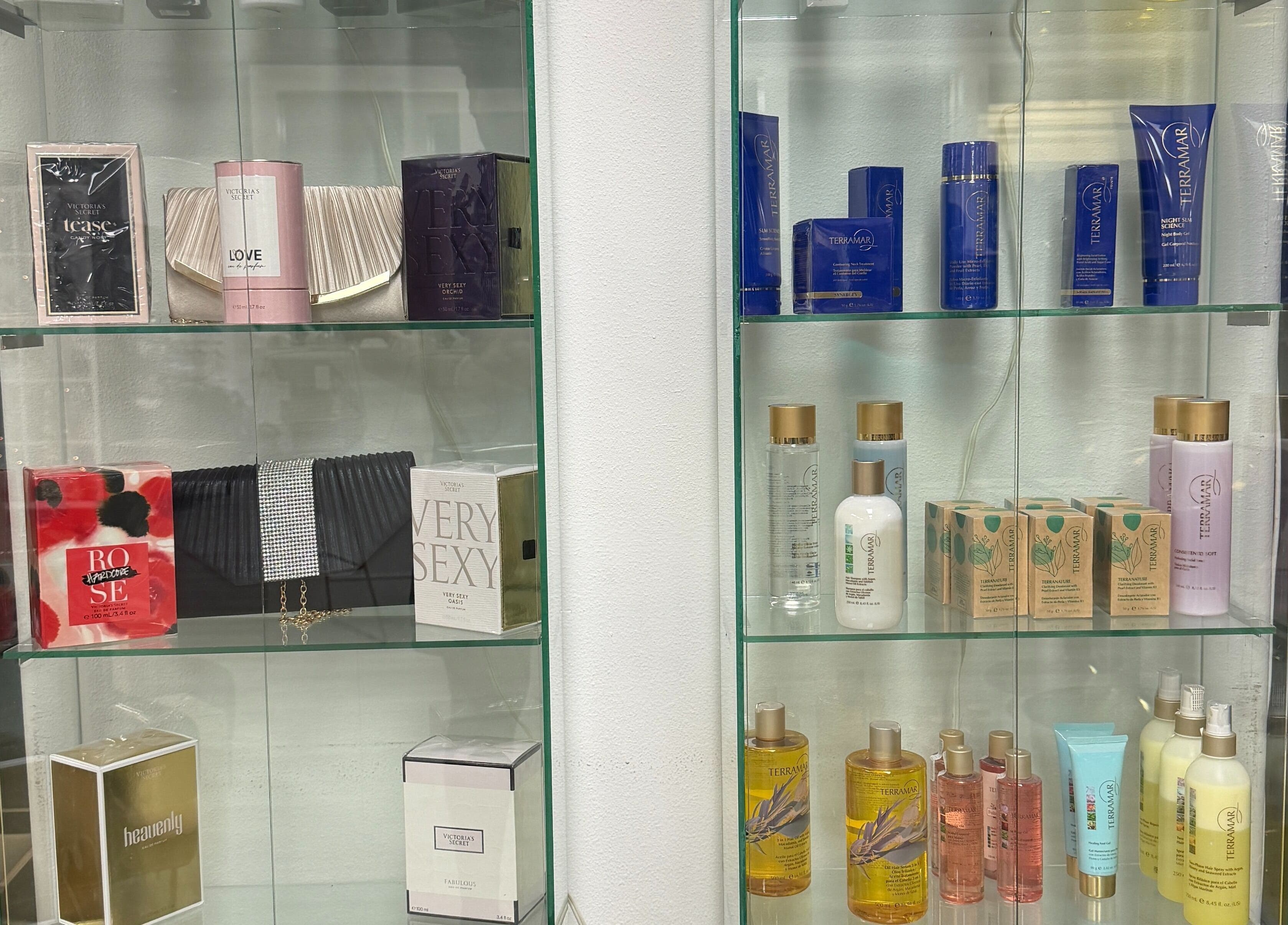 Luxurious beauty products at Euphoria Salon in Mcallen, Texas, US on elegant glass shelves.