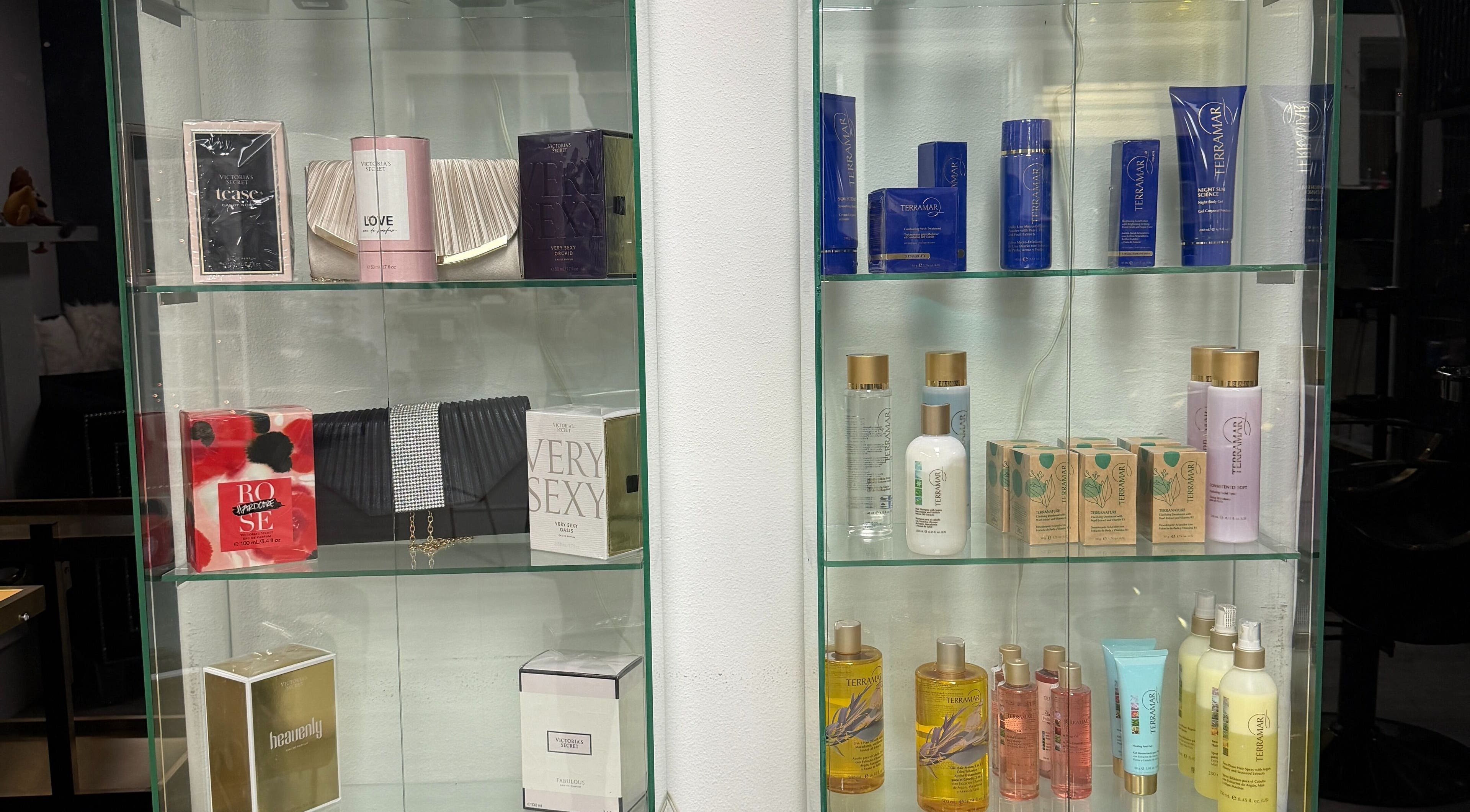 Luxurious beauty products at Euphoria Salon in Mcallen, Texas, US on elegant glass shelves.