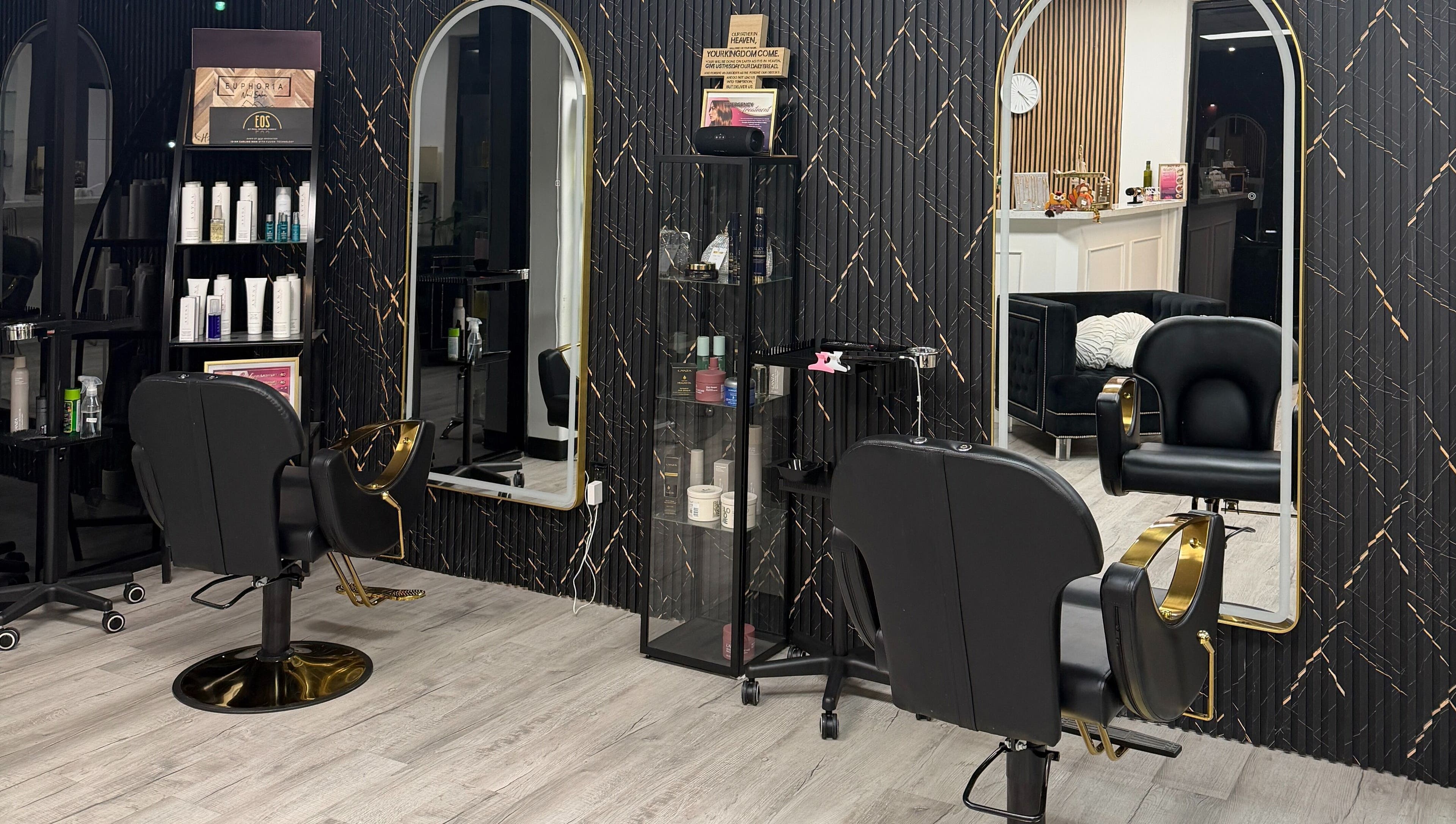 Modern styling chairs and mirrors at Euphoria Salon, Mcallen, Texas, US, showcasing sleek interior design.