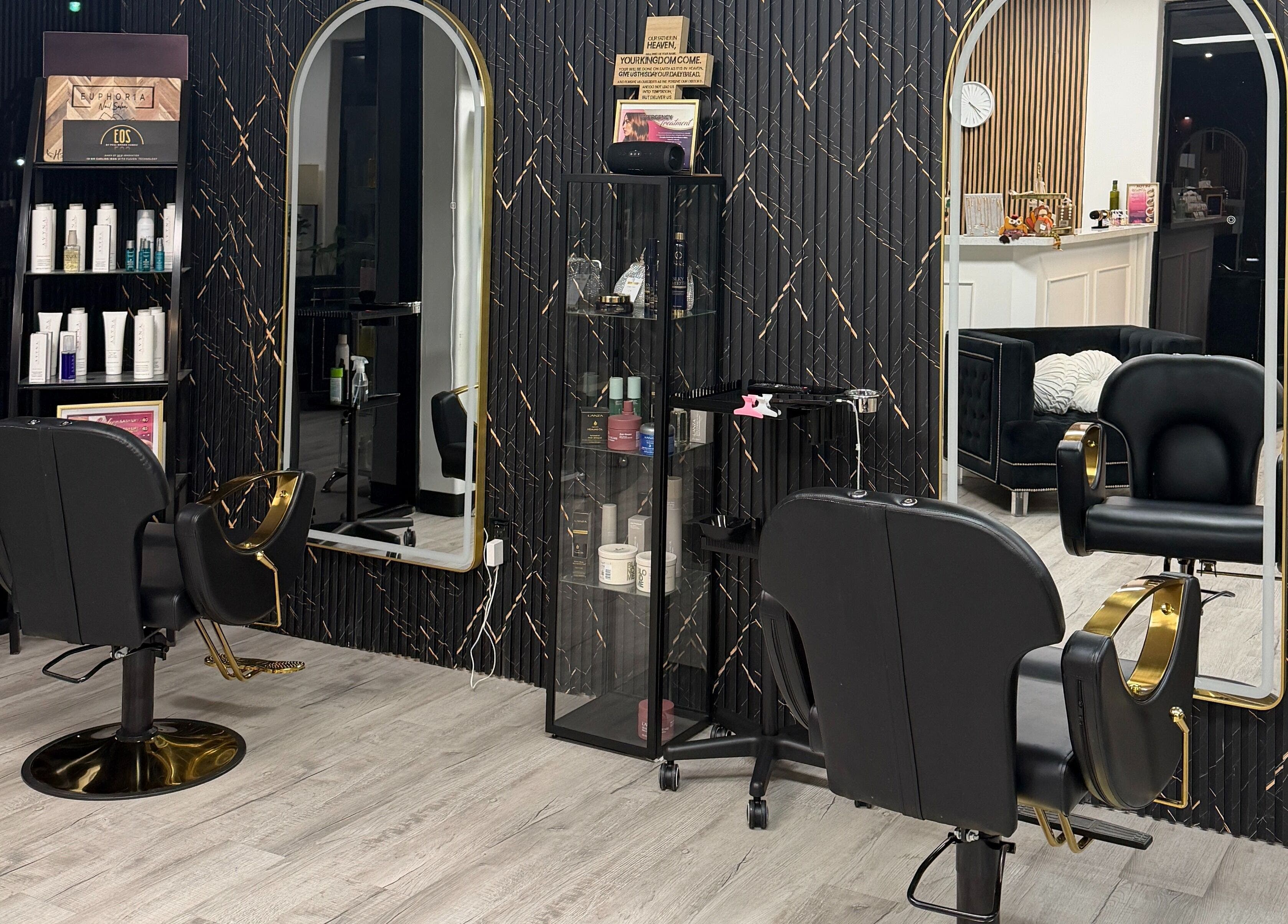 Modern styling chairs and mirrors at Euphoria Salon, Mcallen, Texas, US, showcasing sleek interior design.