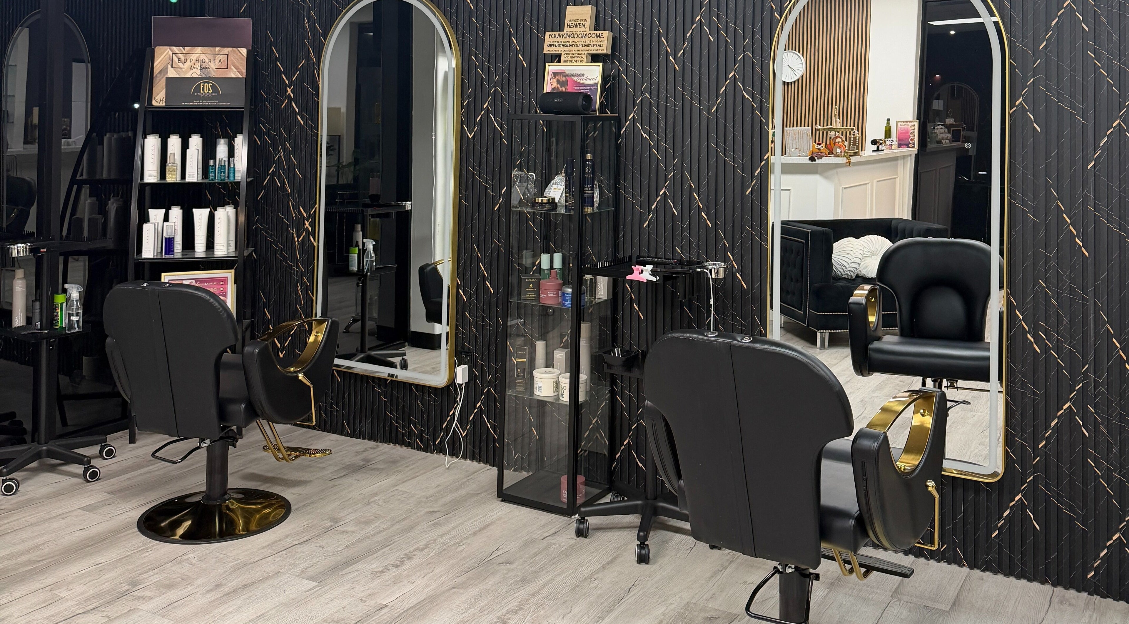 Modern styling chairs and mirrors at Euphoria Salon, Mcallen, Texas, US, showcasing sleek interior design.