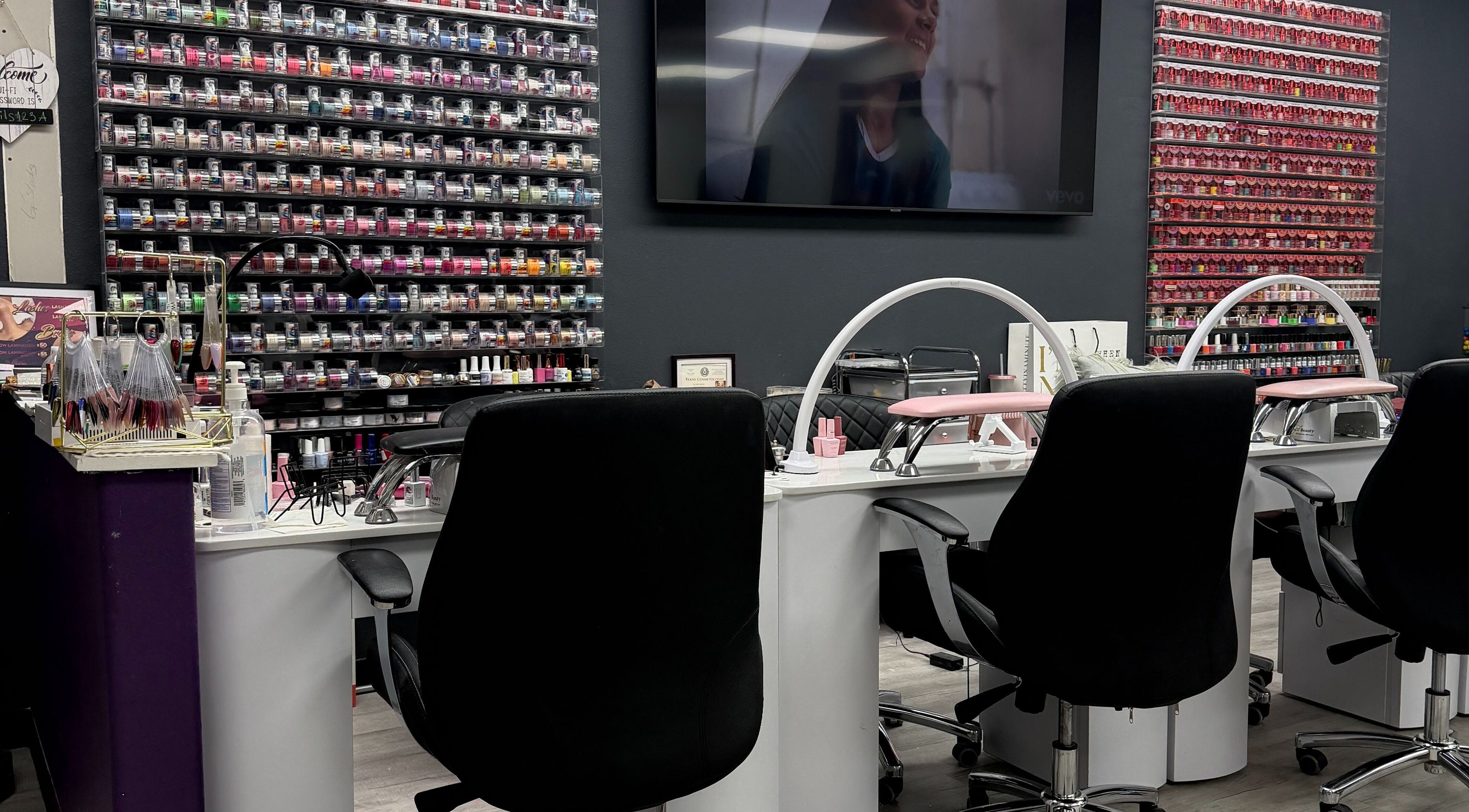 Euphoria Salon nail bar with colorful polish wall in Mcallen, Texas, US.