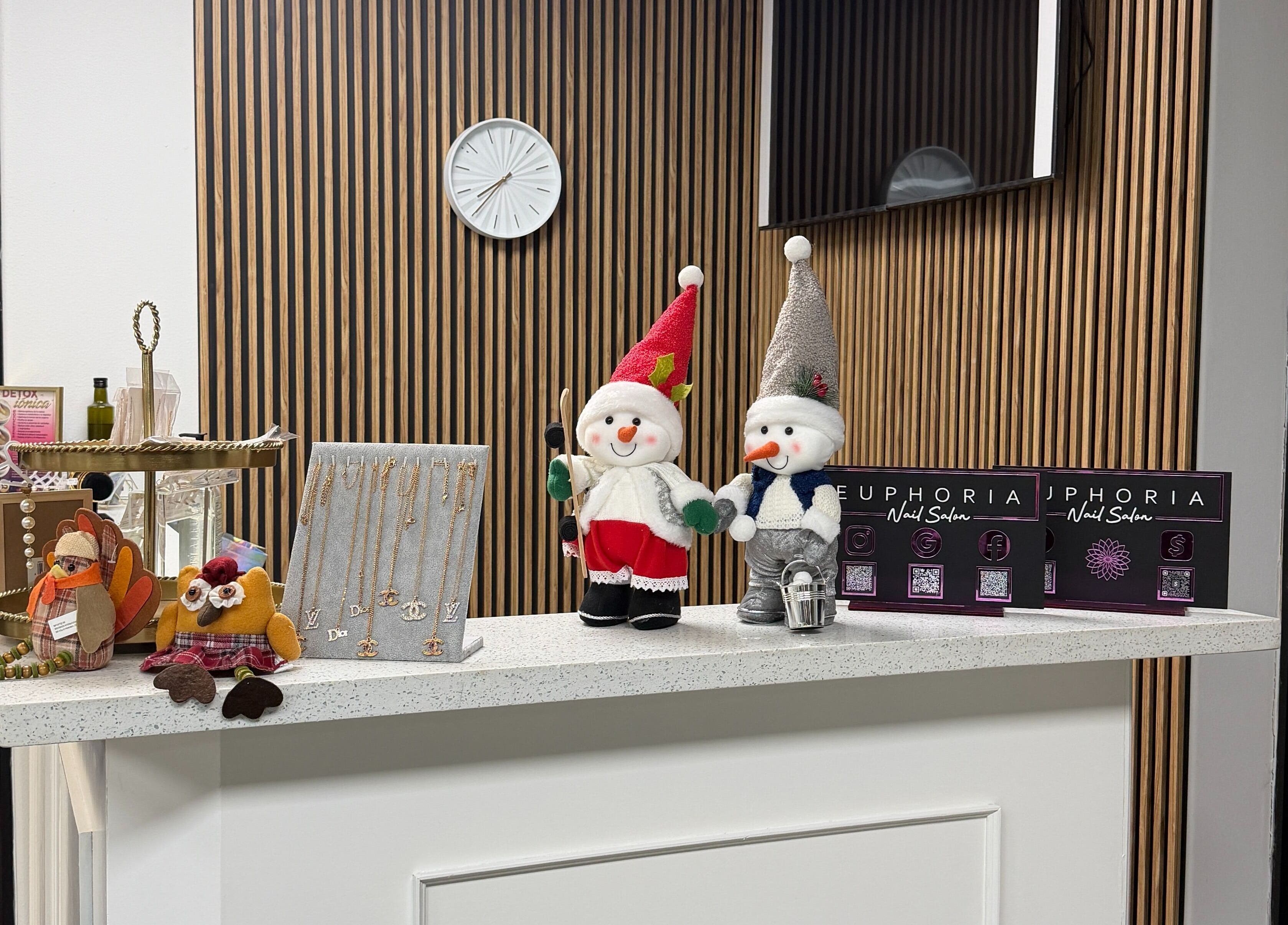 Festive decorations at Euphoria Salon reception in Mcallen, Texas, US featuring snowmen and jewelry.