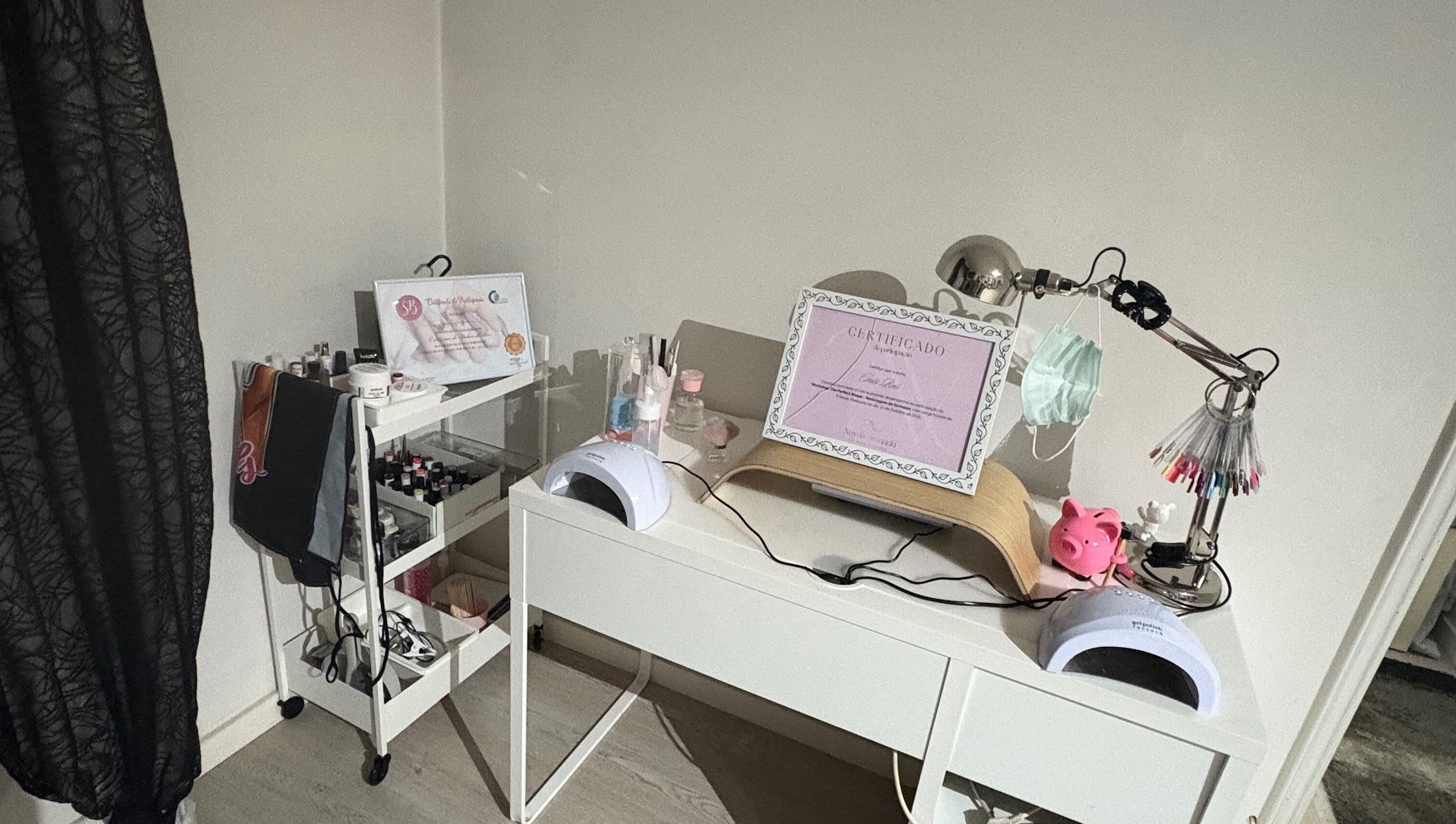 Modern nail studio desk at Thenailsfirst, Queluz, Lisboa, PT, complete with manicure tools and decor.