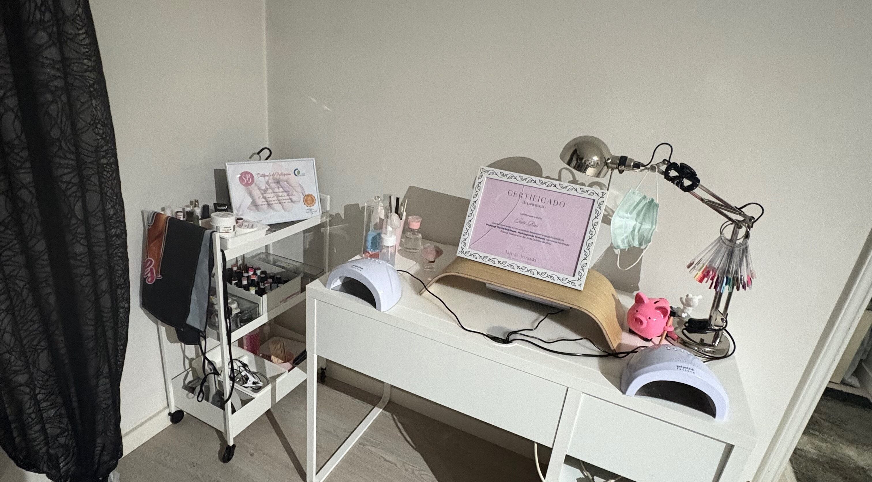 Modern nail studio desk at Thenailsfirst, Queluz, Lisboa, PT, complete with manicure tools and decor.