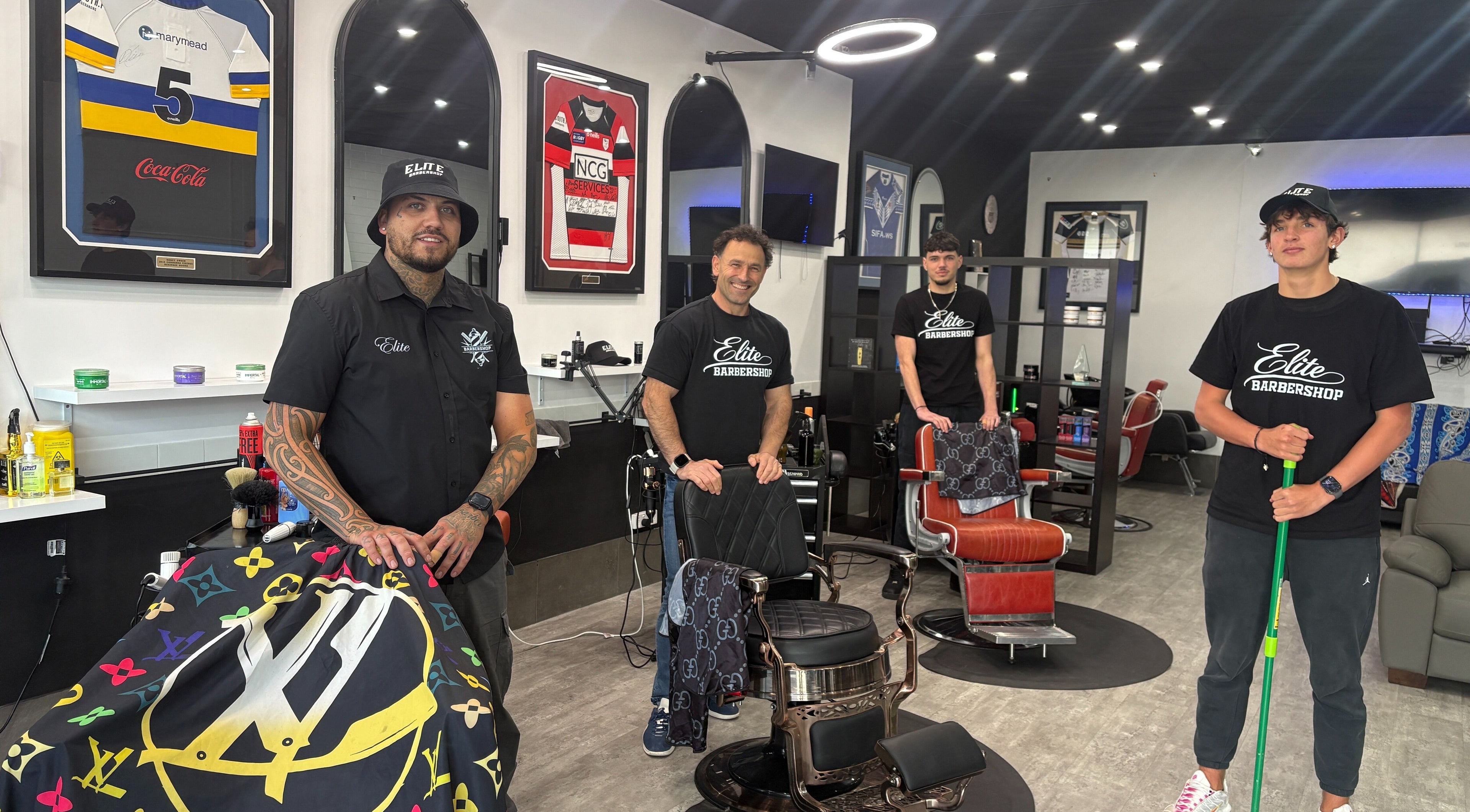 Barbers at The Elite Barbershop in Fyshwick, AU, showcasing a stylish and welcoming environment.