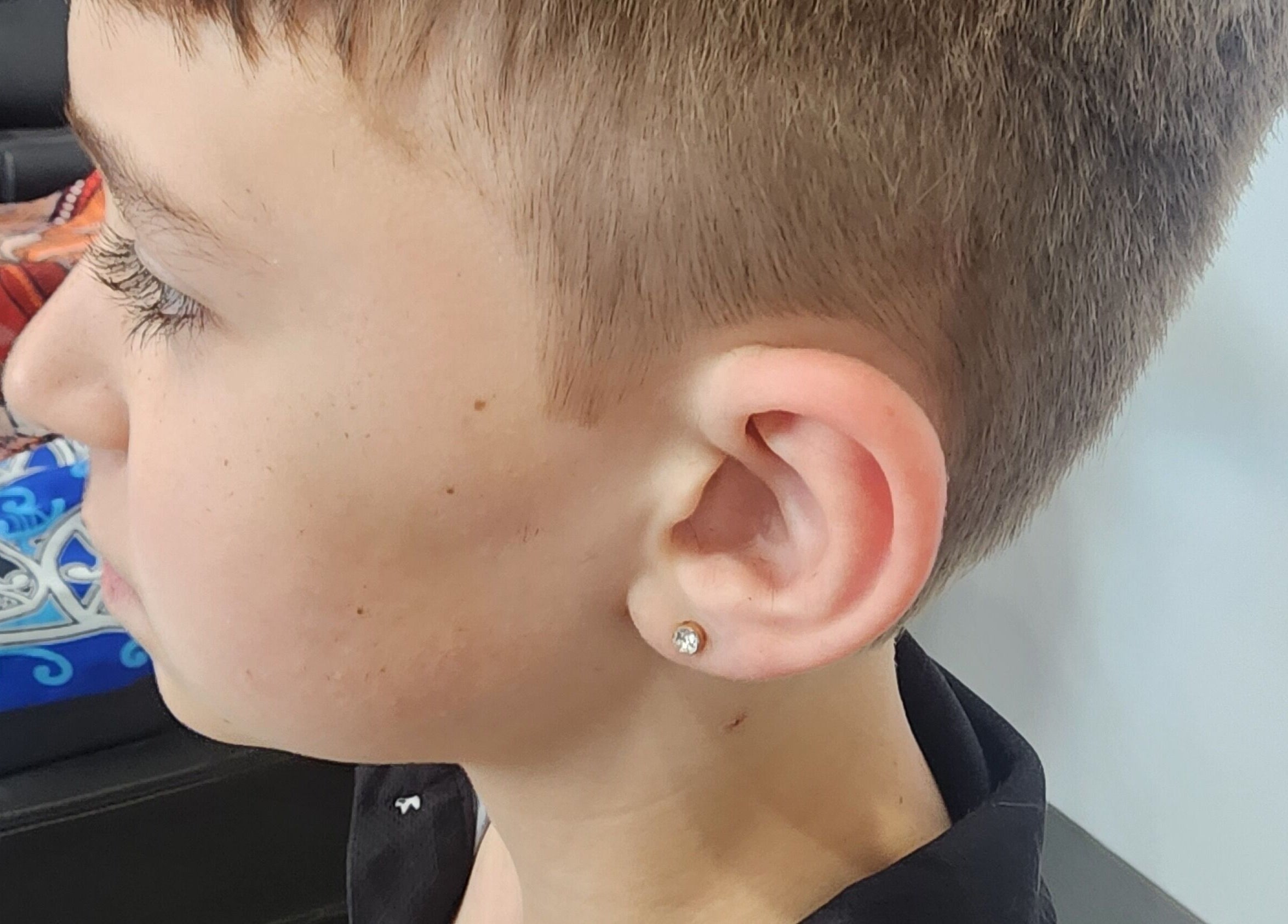 Side profile of a child with a fresh haircut at The Elite Barbershop, Fyshwick, Australian Capital Territory, AU.