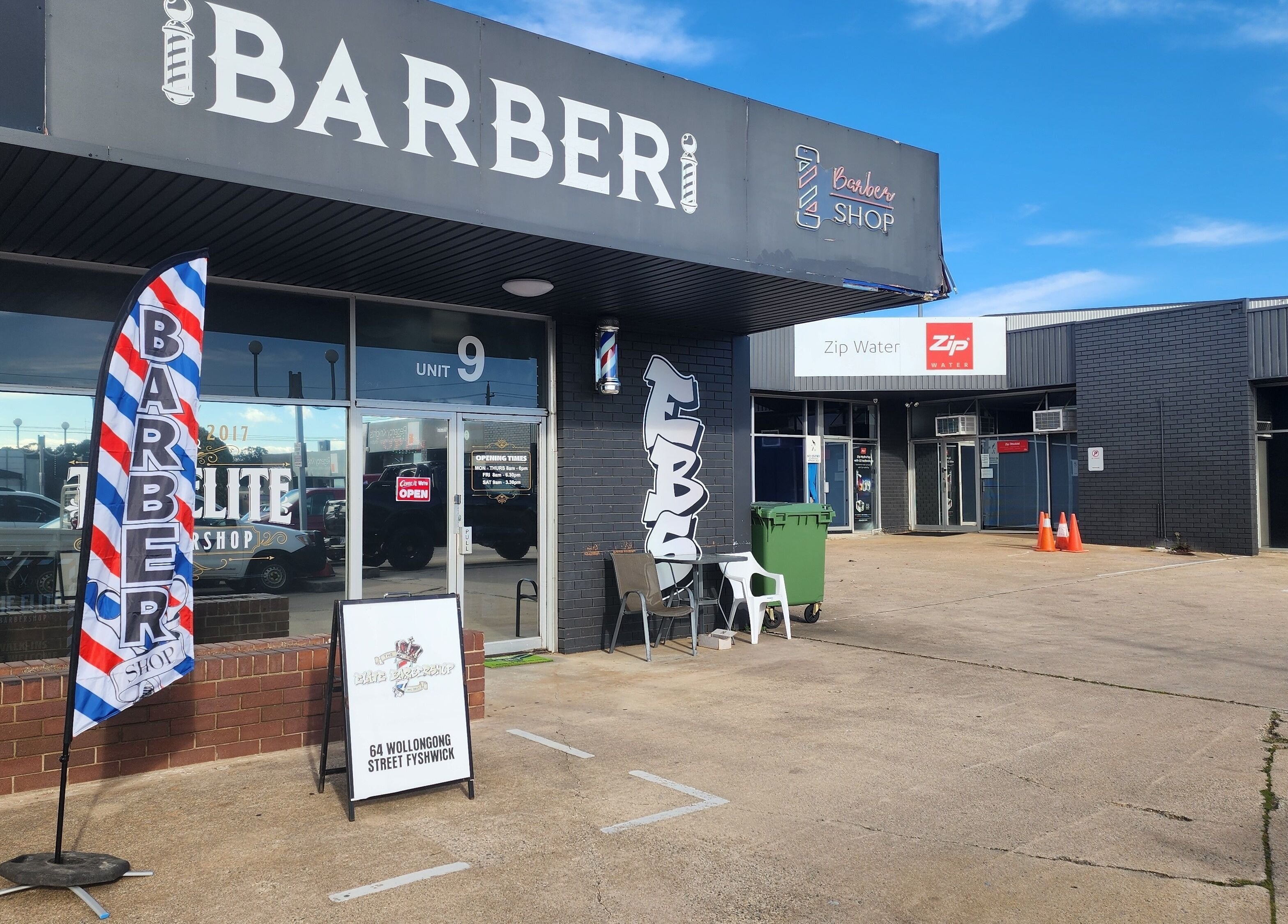 The Elite Barbershop entrance in Fyshwick, Australian Capital Territory, AU, showcasing its inviting facade.