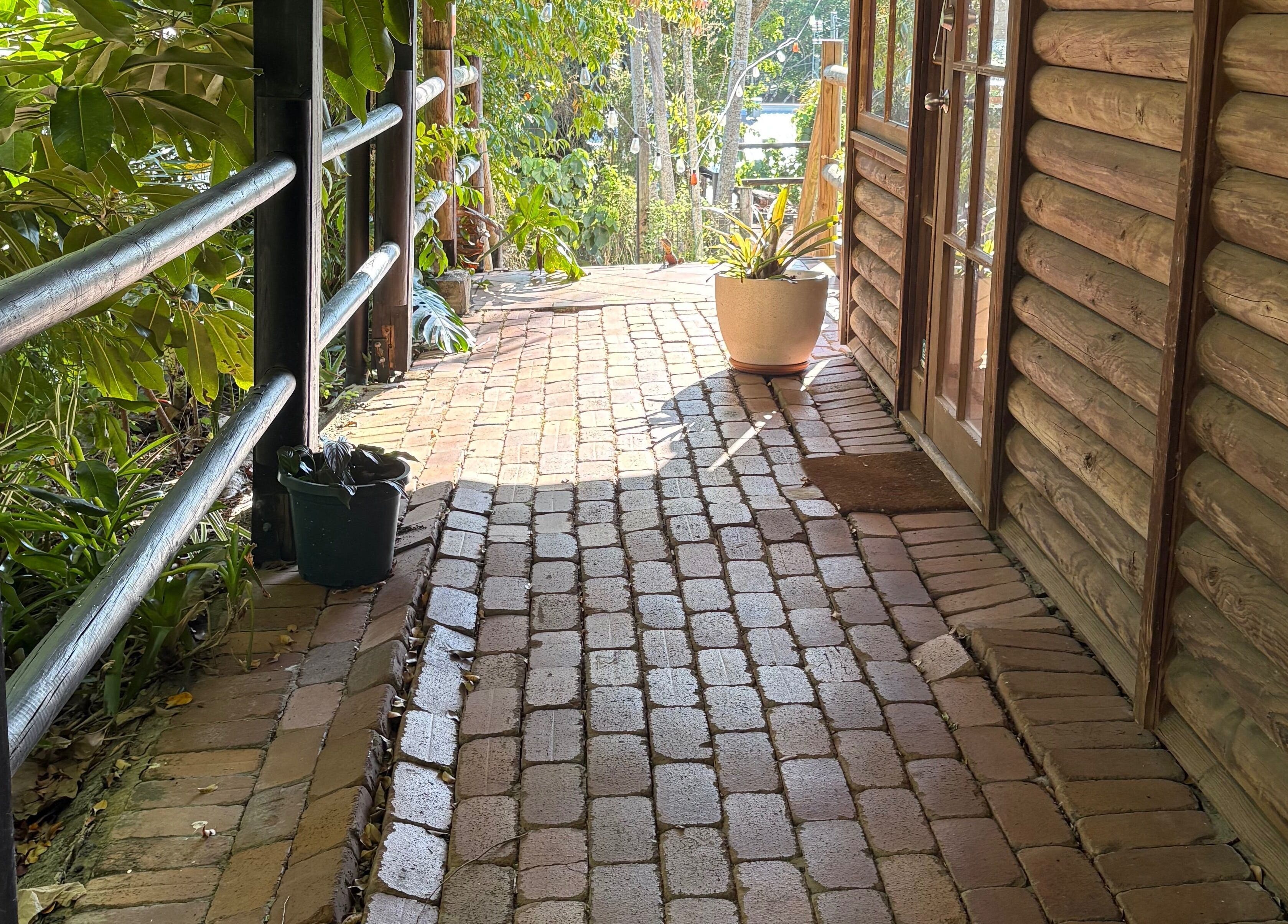 Inviting brick pathway at Melba Stewart Brows & Body, Eumundi, Queensland, AU, offering a serene entryway.