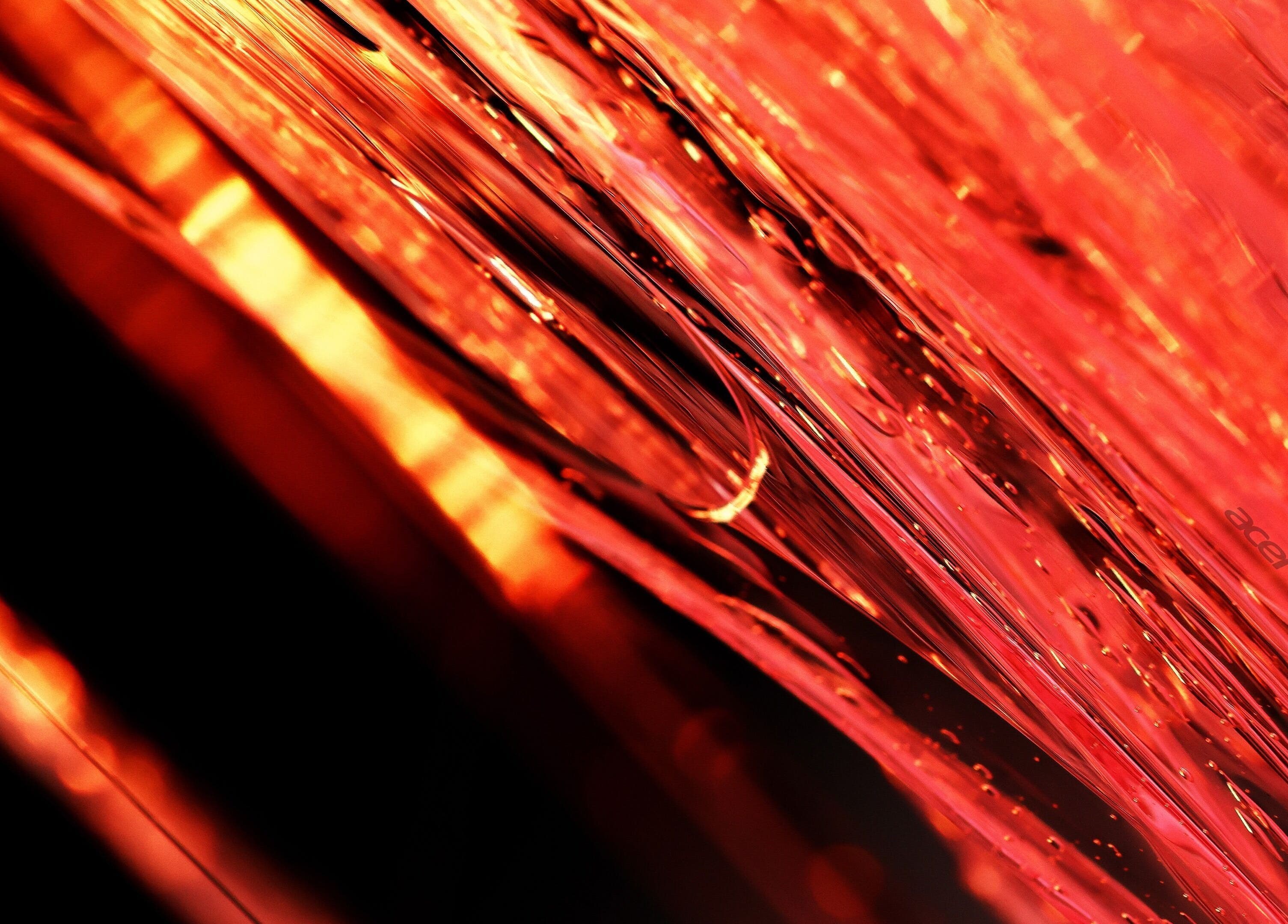 Abstract red light waves at Pelos Locos, Monterrey, Nuevo León, MX. Vibrant salon ambiance and energy.