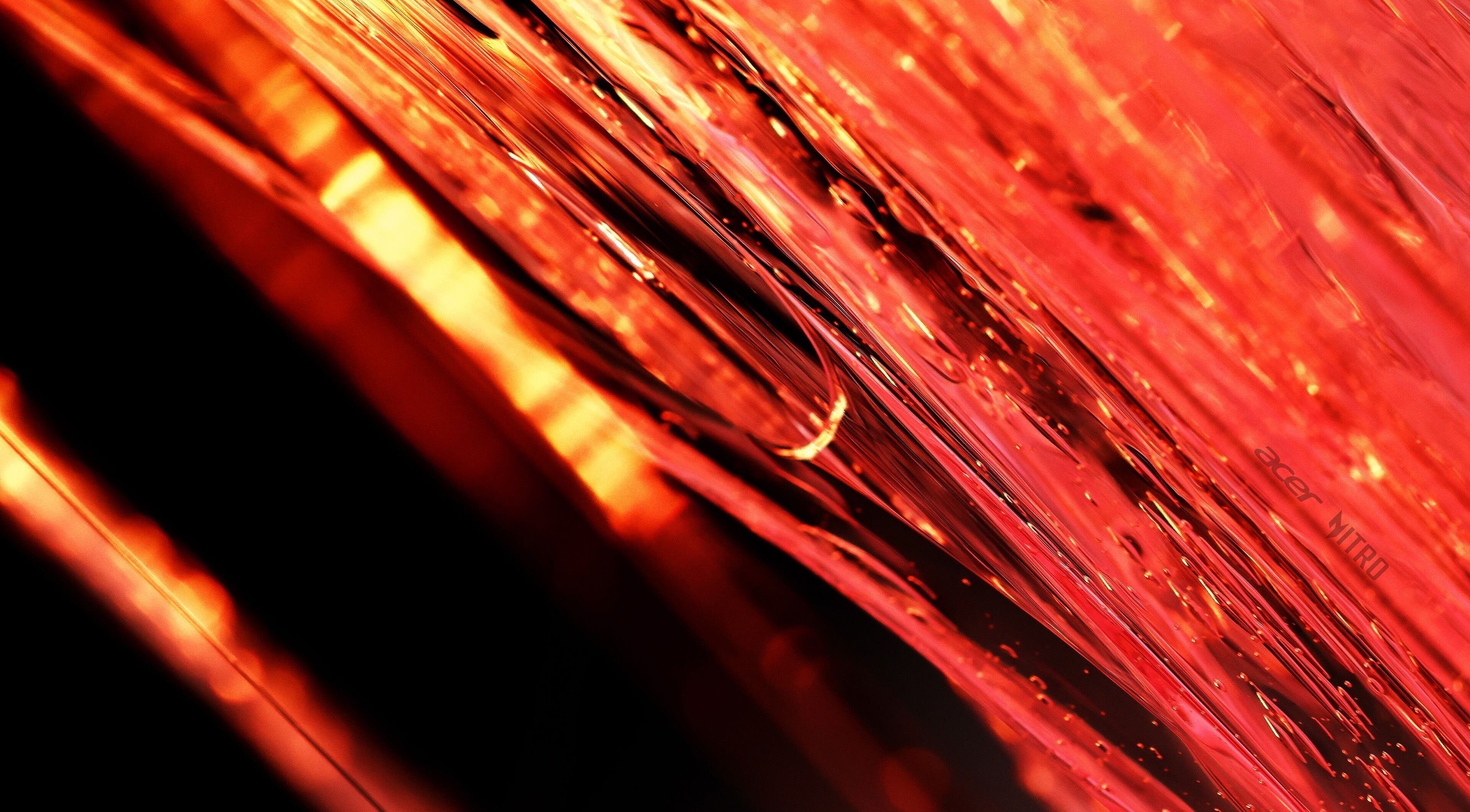 Abstract red light waves at Pelos Locos, Monterrey, Nuevo León, MX. Vibrant salon ambiance and energy.