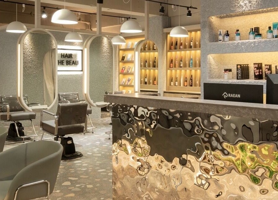 Modern interior of Hair The Beau Nowon, 서울특별시, KR, showcasing sleek chairs and stylish product displays.