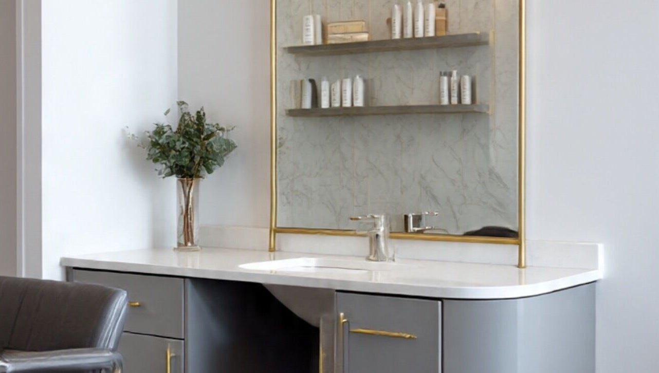 Sleek salon vanity at LuxehairbyJo in Wellington, Florida, US, featuring modern decor and premium products.