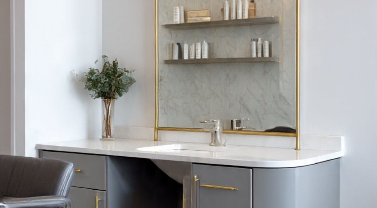 Sleek salon vanity at LuxehairbyJo in Wellington, Florida, US, featuring modern decor and premium products.