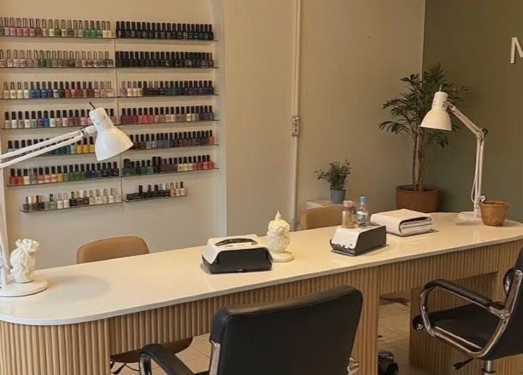 Manicure station at Haven Beaute, Jawa Timur, ID, showcasing a range of nail polish colors.