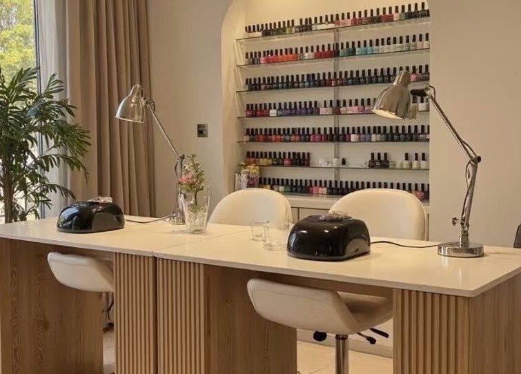 Modern nail bar at Haven Beaute, Jawa Timur, Jawa Timur, ID, featuring sleek decor and a wide range of nail colors.
