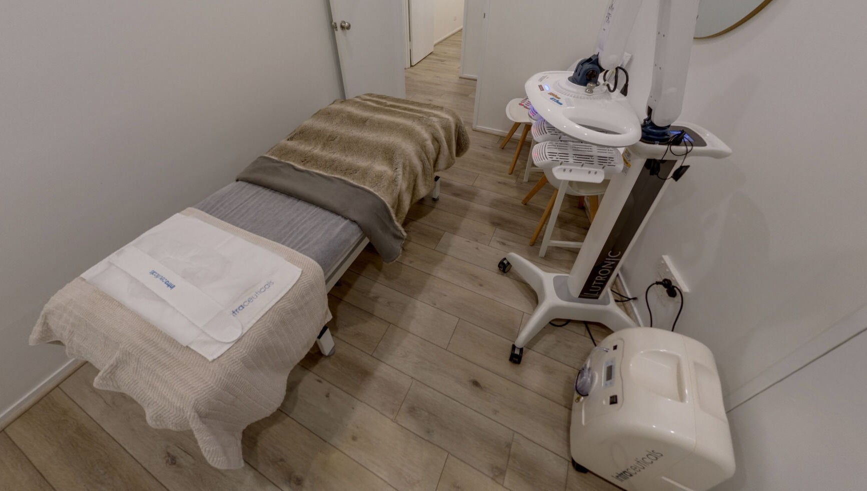 Luxurious treatment room at Skin and Laser Studio, St Leonards, New South Wales, AU with plush bedding and advanced equipment.