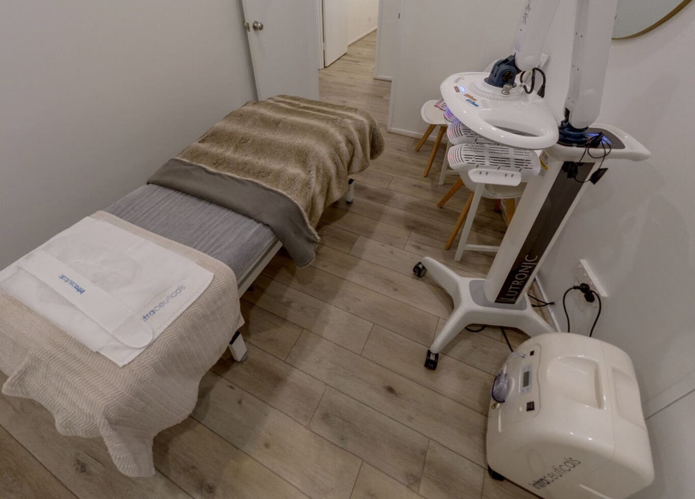 Luxurious treatment room at Skin and Laser Studio, St Leonards, New South Wales, AU with plush bedding and advanced equipment.