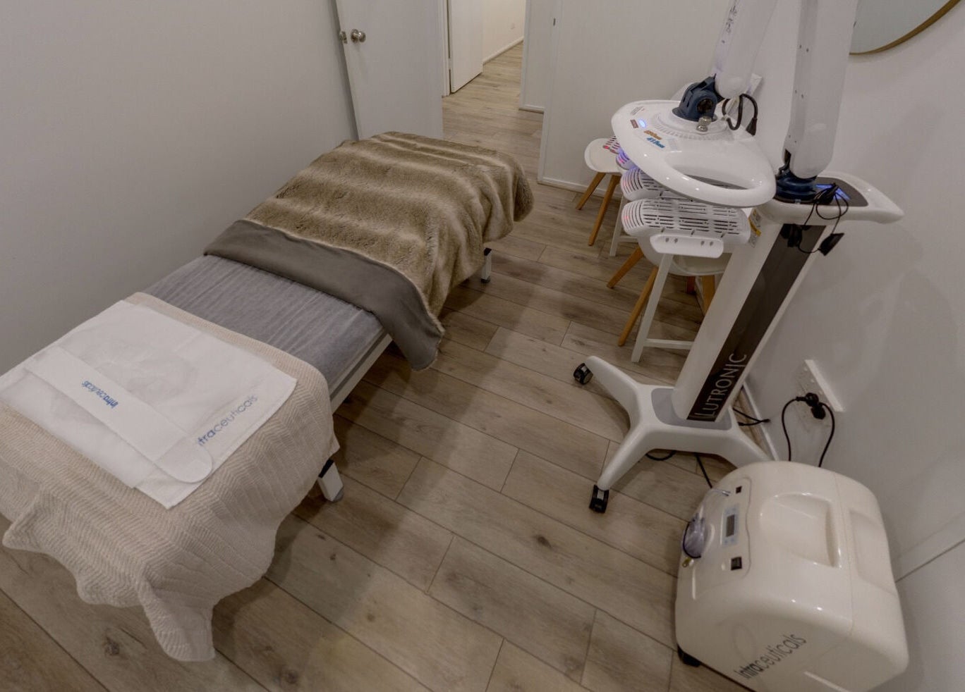 Luxurious treatment room at Skin and Laser Studio, St Leonards, New South Wales, AU with plush bedding and advanced equipment.