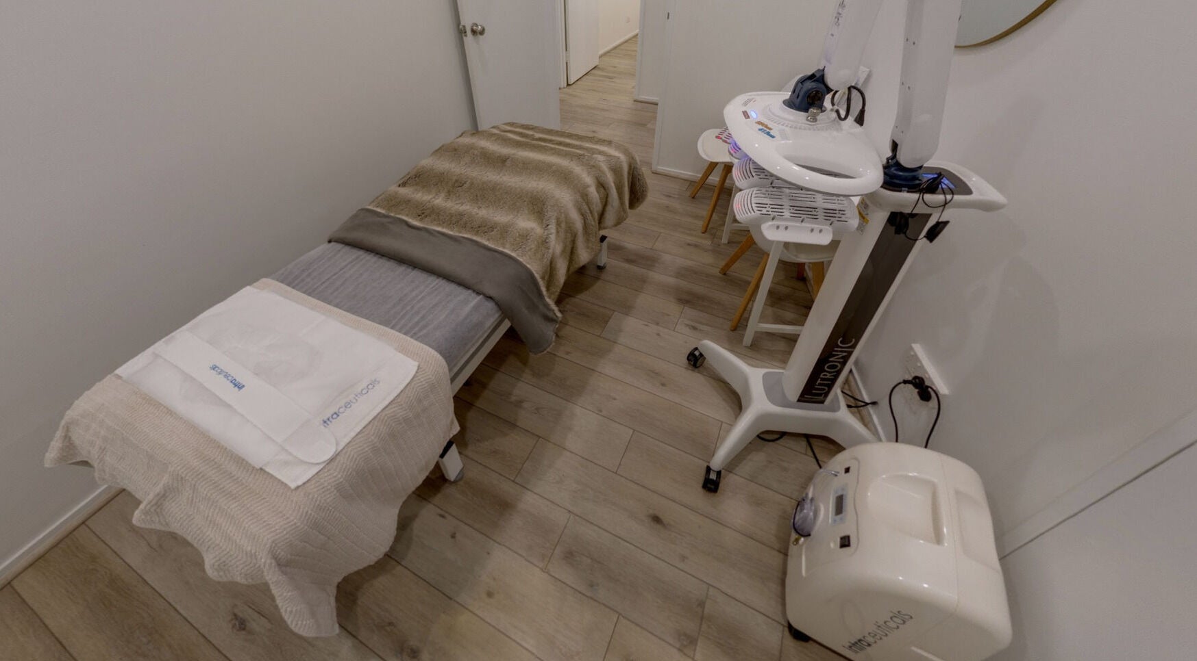Luxurious treatment room at Skin and Laser Studio, St Leonards, New South Wales, AU with plush bedding and advanced equipment.